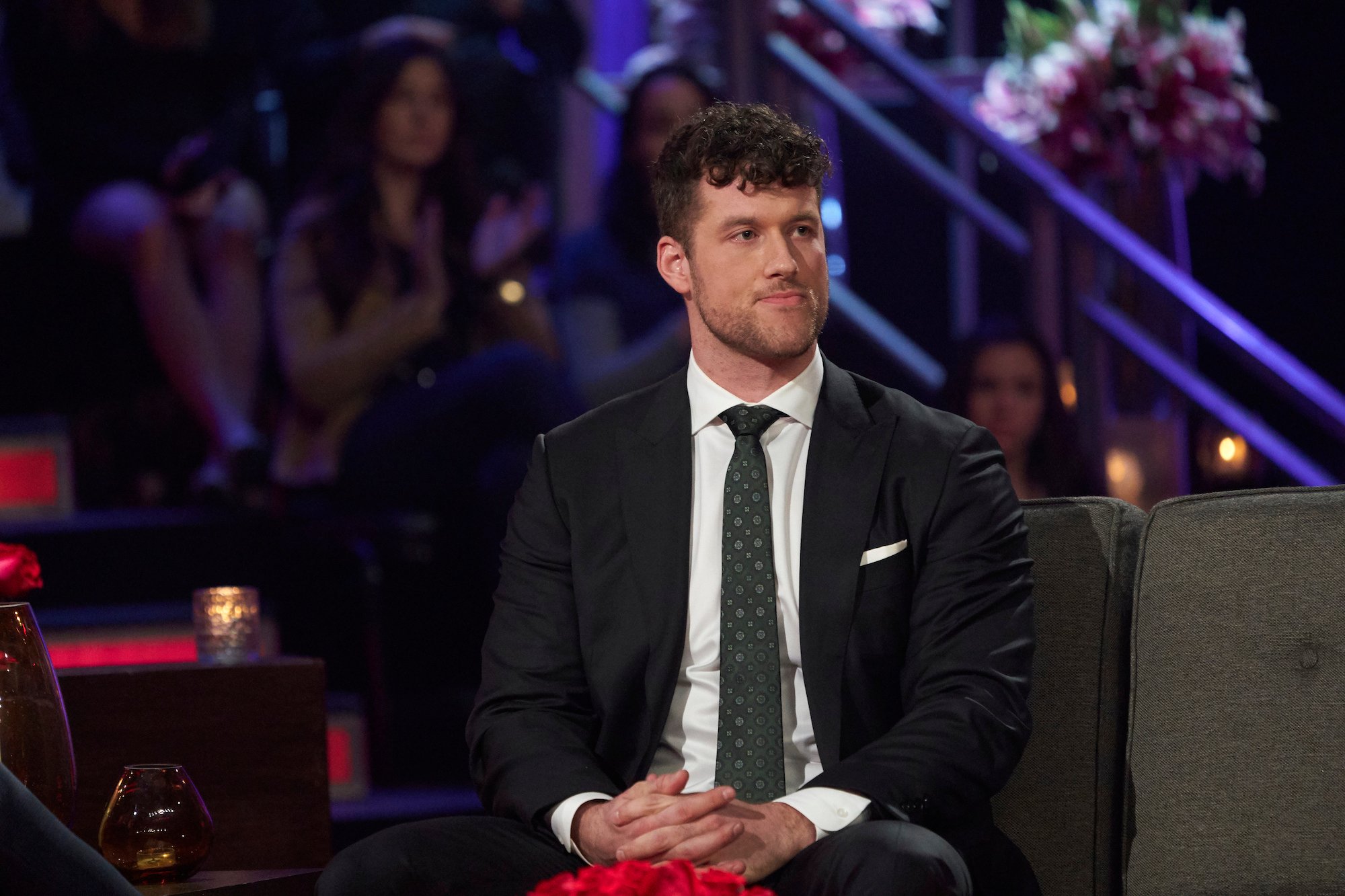 'The Bachelor' Clayton Echard wearing a suit in a production still from the 'Women Tell All'