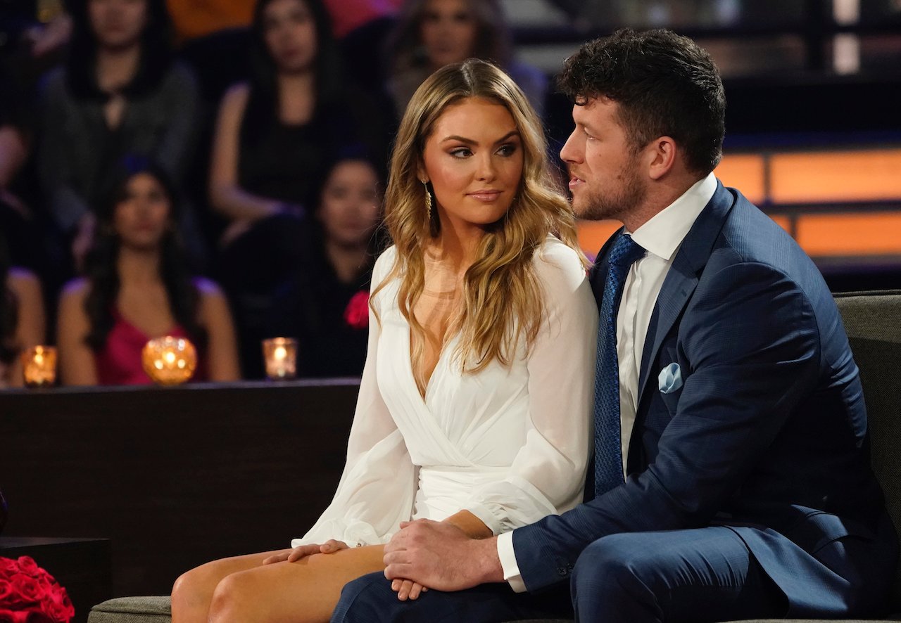 Susie Evans looks at Clayton Echard as they sit together on stage on 'The Bachelor'.