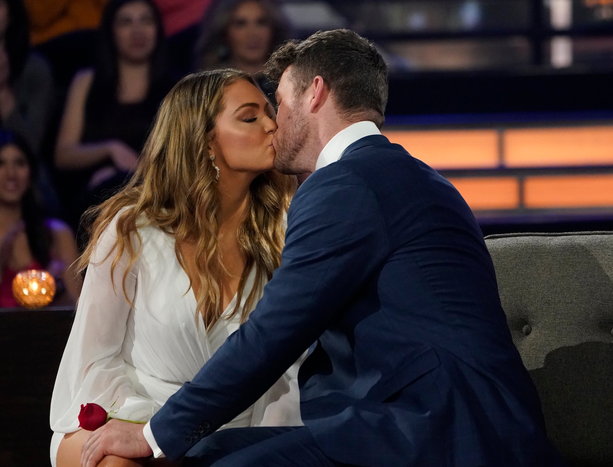 'The Bachelor' couple Susie Evans and Clayton Echard kiss on stage during the finale.