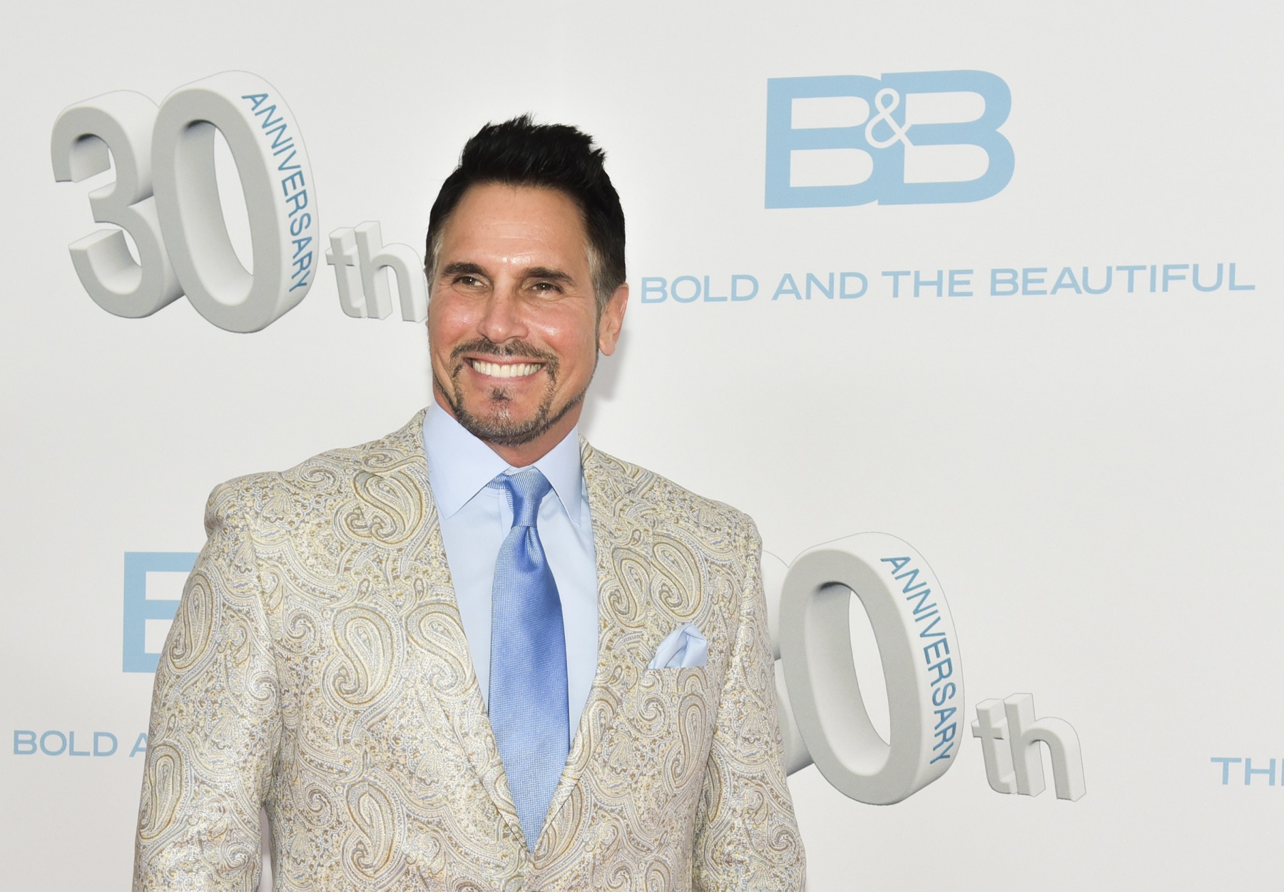 The Bold and the Beautiful star Don Diamont on the red carpet wearing a white linen jacket and a blue tie