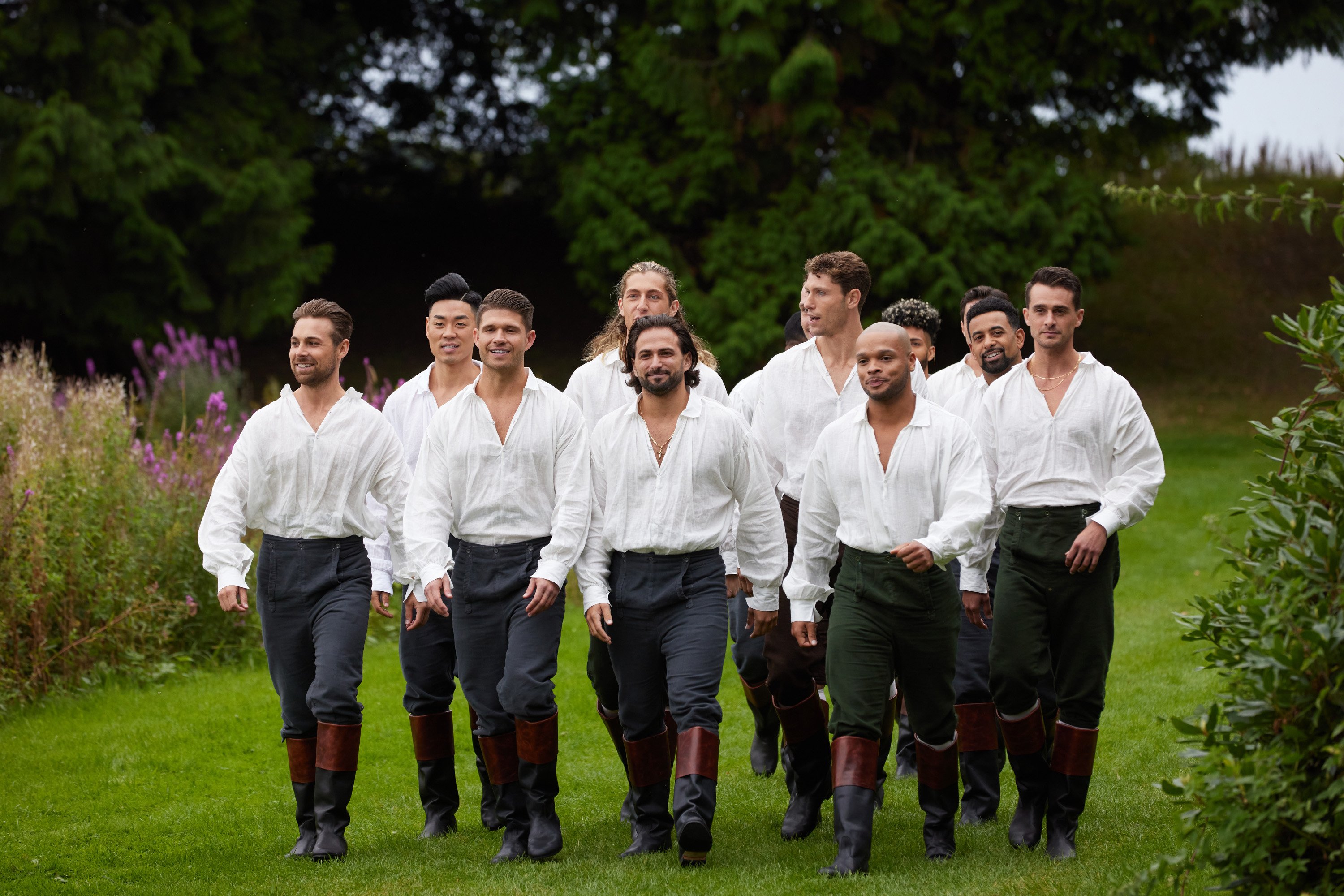 Derek Kesseler, Danny Kim, Dan Hunter, Peter Saffa, Giuseppe Castronovo, Lincoln Chapman, Alex Achilles Diaz King, Nate Shanklin, Daniel Bochicchio walk through a field in 'The Courtship'