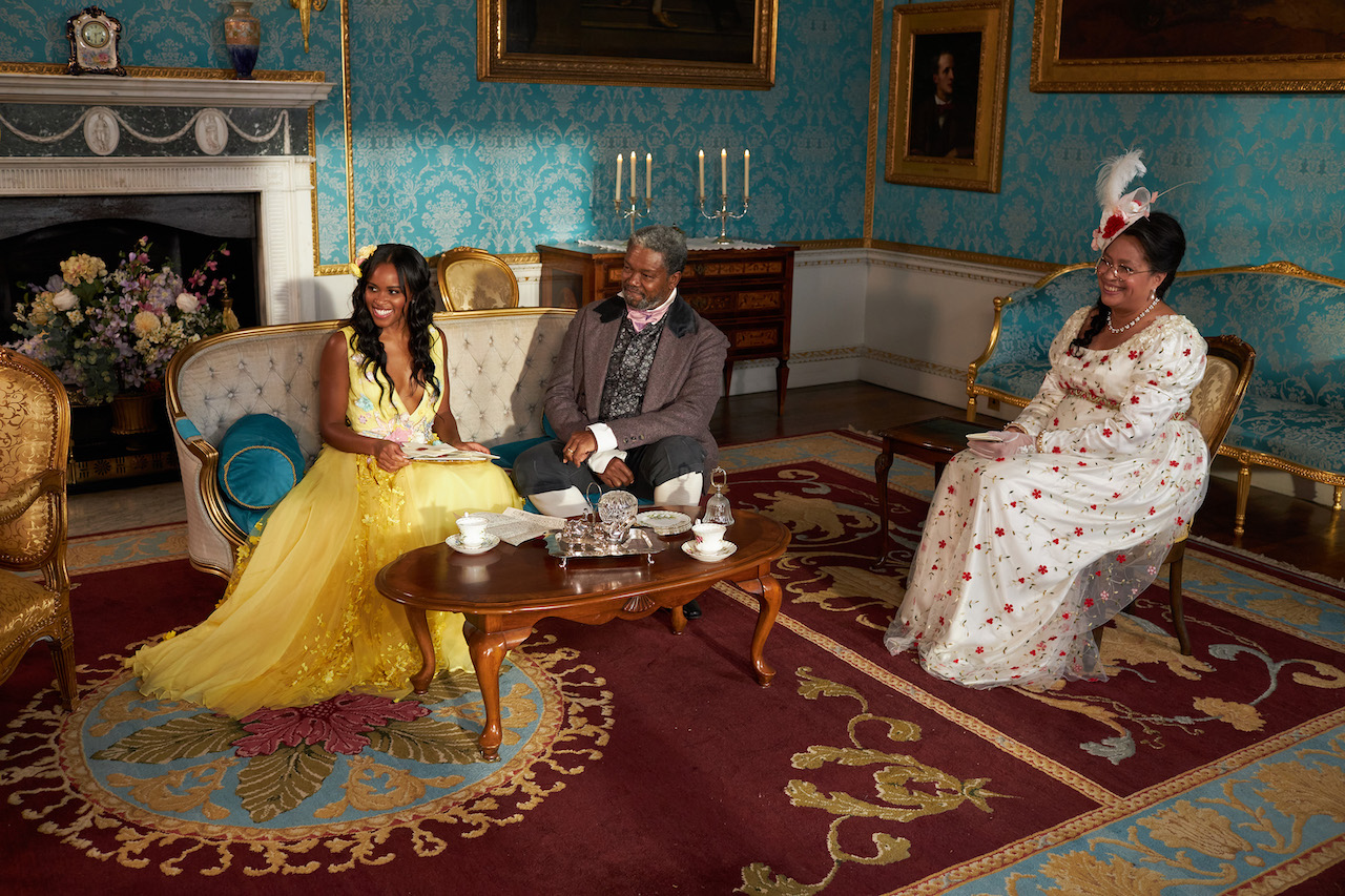 Nicole Remy, Claude Remy, Dr. Claire Spain-Remy sit together in a sitting room in the castle on 'The Courtship'.