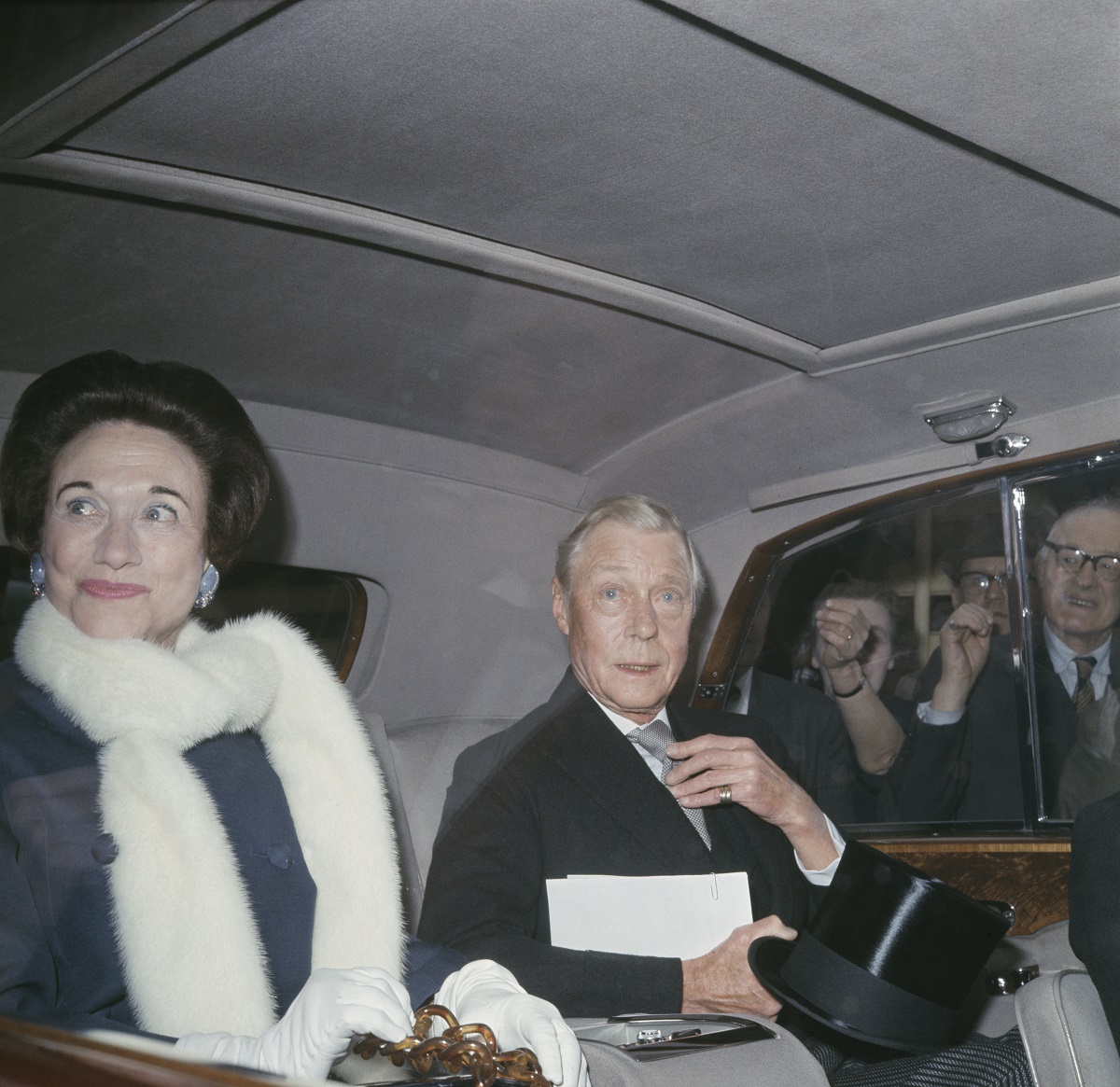 The Duke and Duchess of Windsor in the back of a car ahead of a ceremony at Marlborough House in London