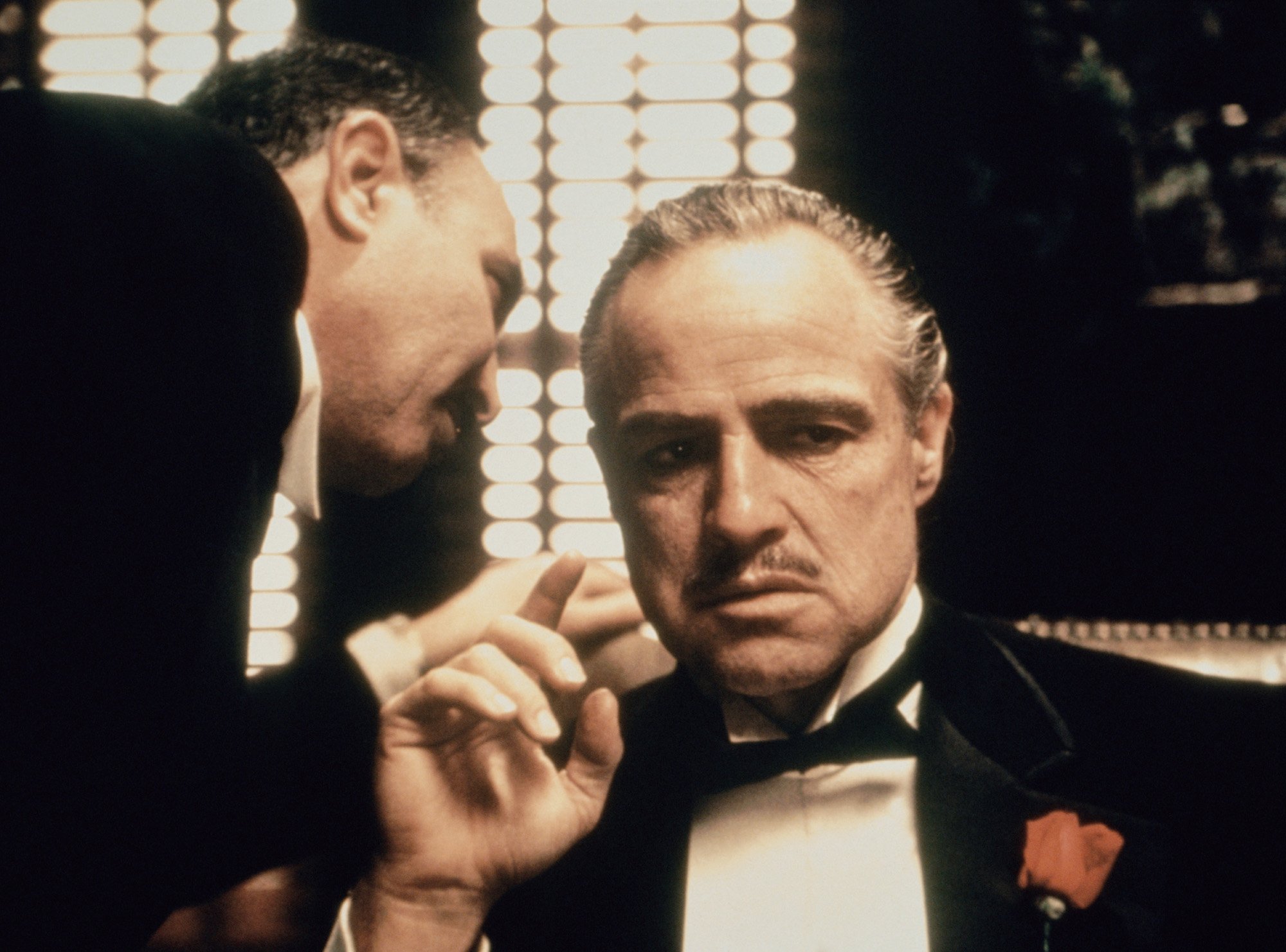 'The Godfather' cast members Salvatore Corsitto whispers into Marlon Brando's ear