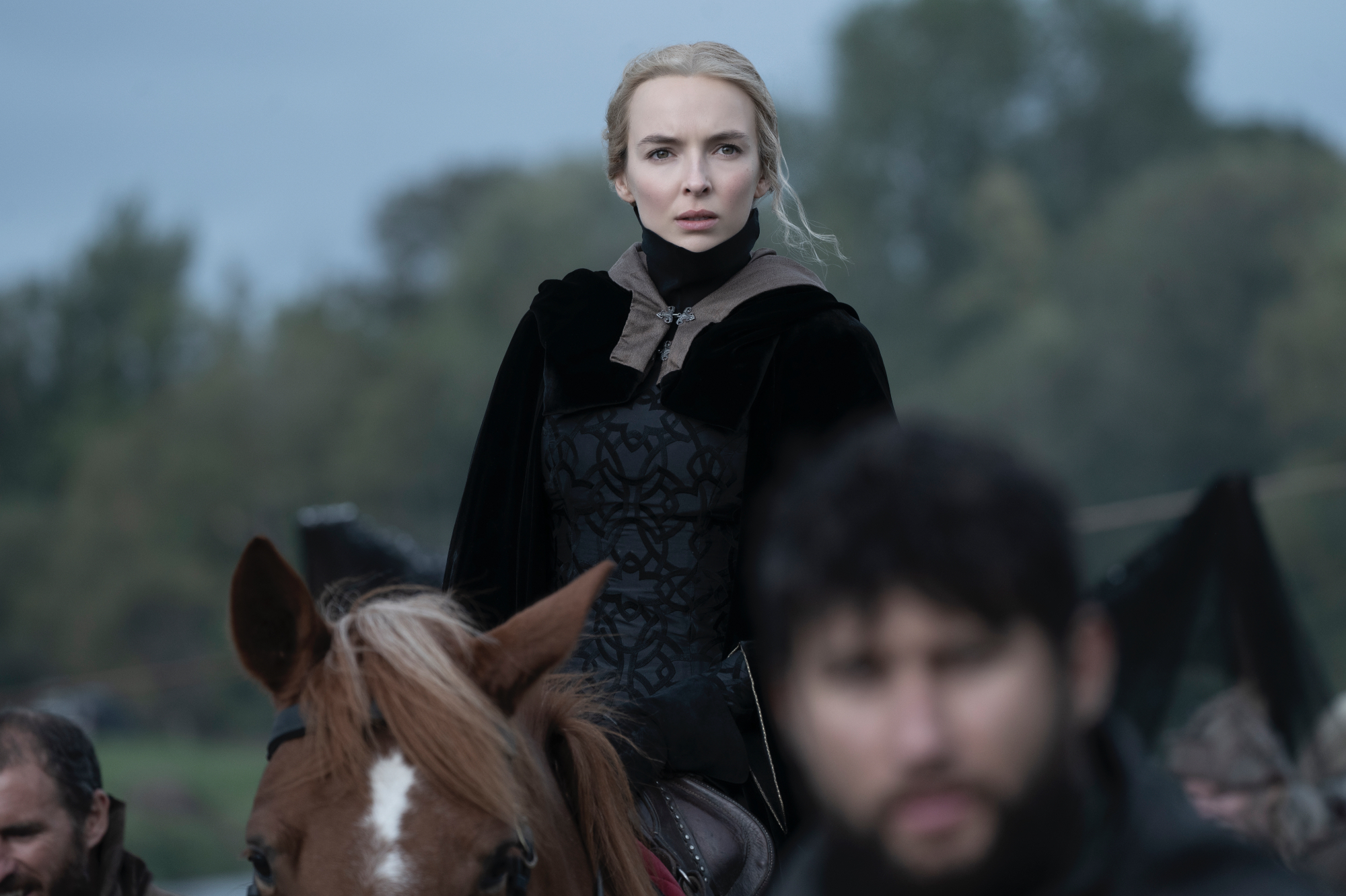 'The Last Duel' Jodie Comer as Marguerite de Carrouges wearing black on top of a horse