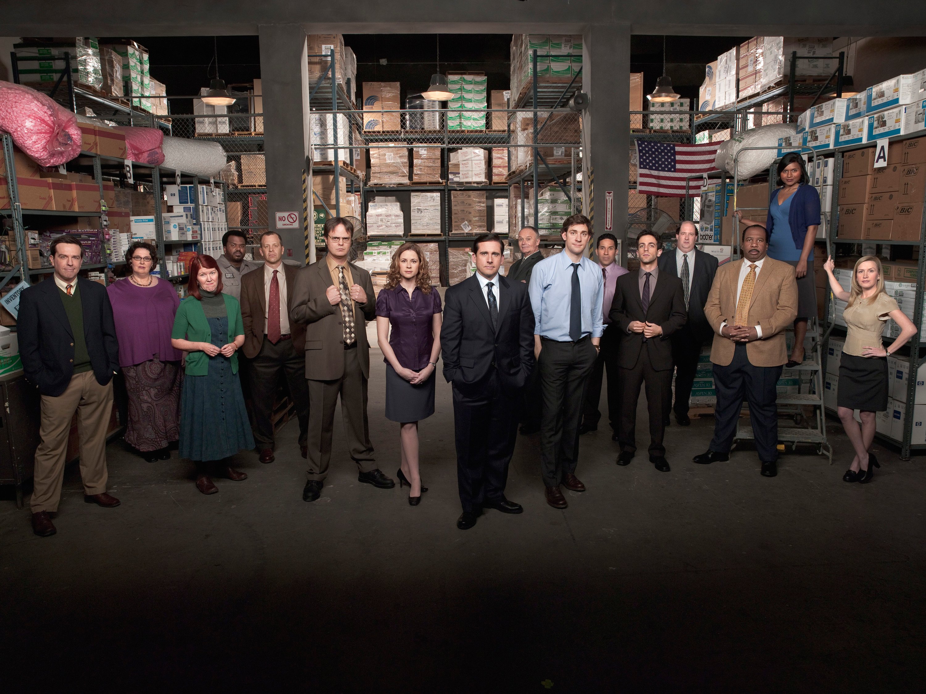 The cast of 'The Office' poses for a promotional photo in the warehouse