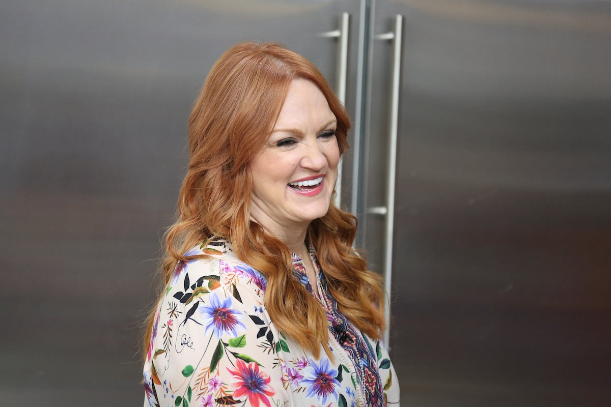 The Pioneer Woman Ree Drummond smiles wearing a multicolor shirt