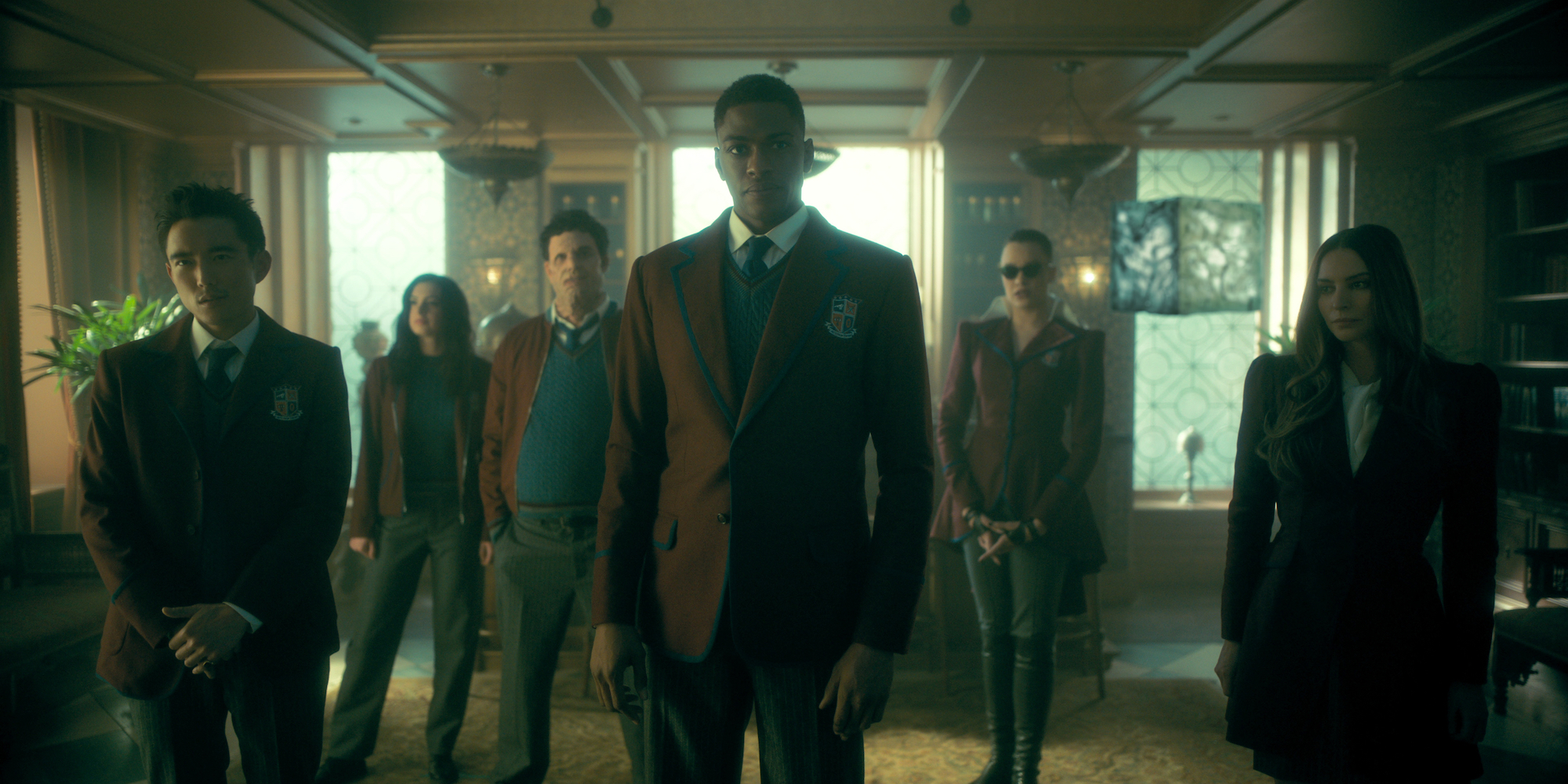 'The Umbrella Academy' Season 3 will feature The Sparrow Academy, seen here standing in a group with burgundy jackets on.
