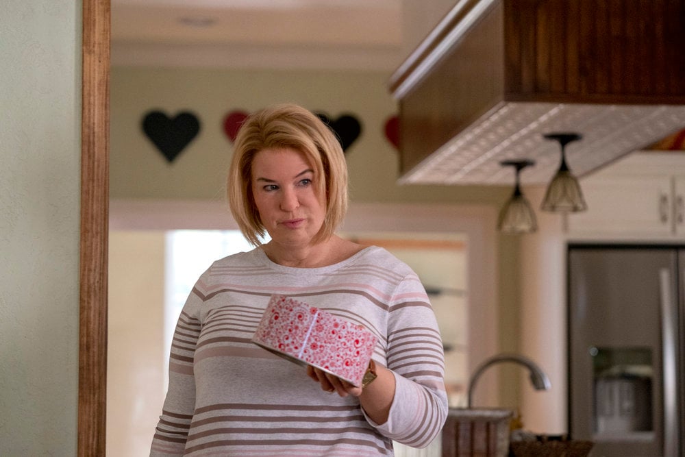 'The Thing About Pam' star Renée Zellweger holds a decorative tin in a production still from the limited series.