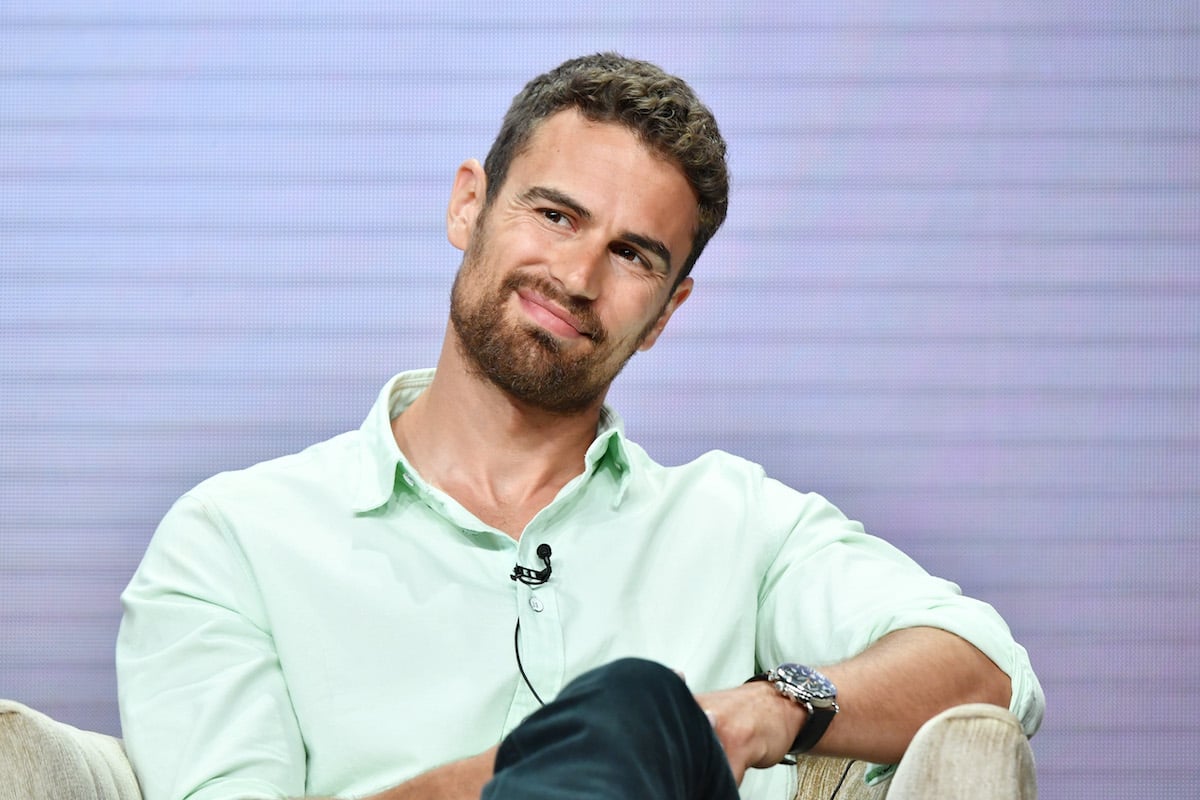 Wearing a green button-up shirt, Theo James of 'Sanditon' speaks during the PBS segment of the Summer 2019 Television Critics Association Press Tour