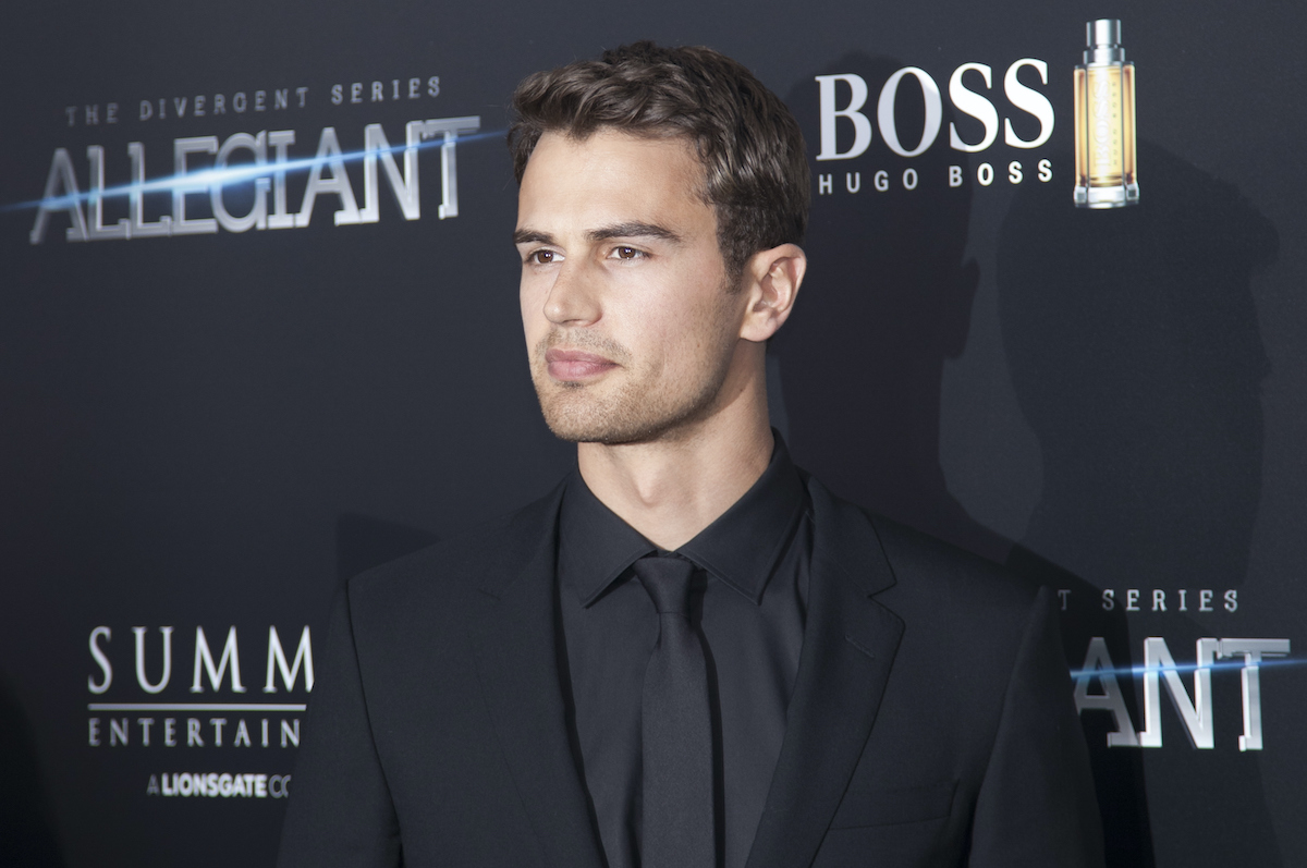 Divergent star Theo James wears all black to a movie premiere