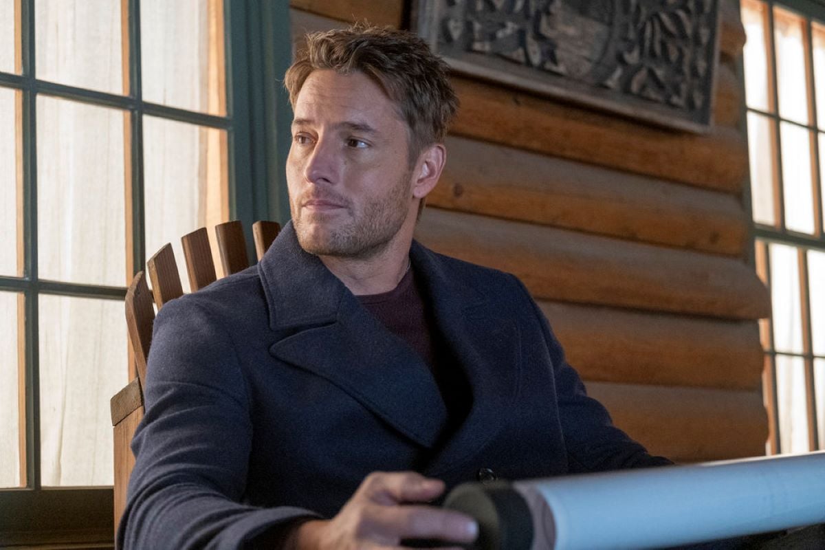 'This Is Us' Season 6 Episode 8 star Justin Hartley, in character as Kevin Pearson, wears a gray coat over a maroon sweater.