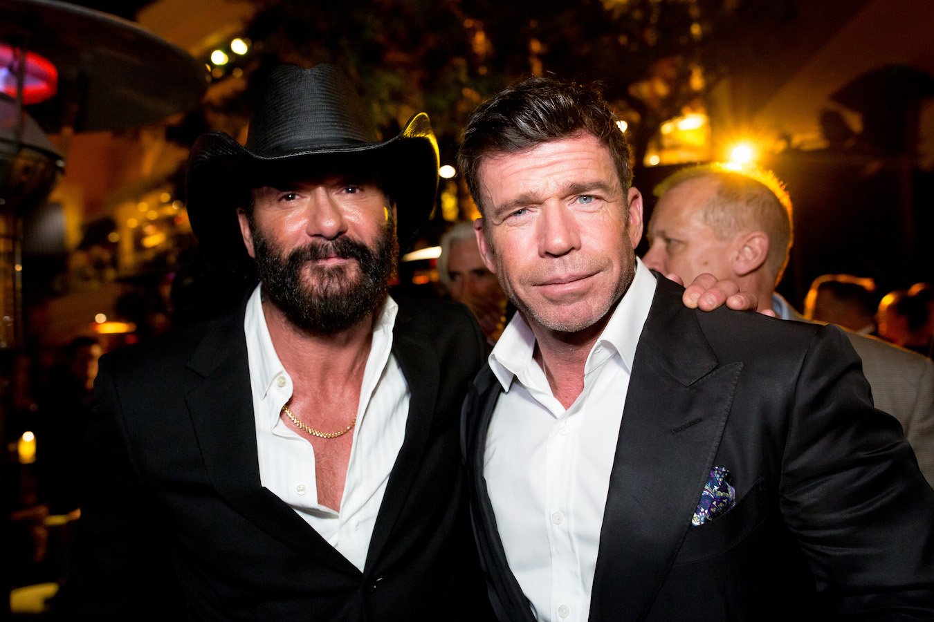 Tim McGraw and Taylor Sheridan standing next to each other at an event for '1883'