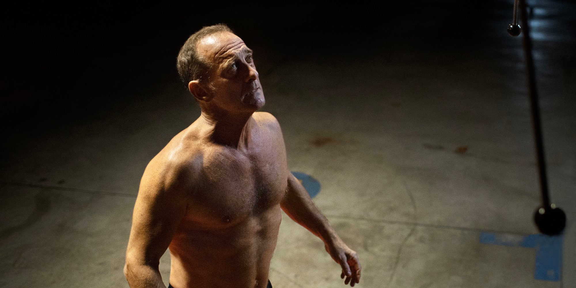 'Titane' Vincent Lindon as Vincent shirtless looking up