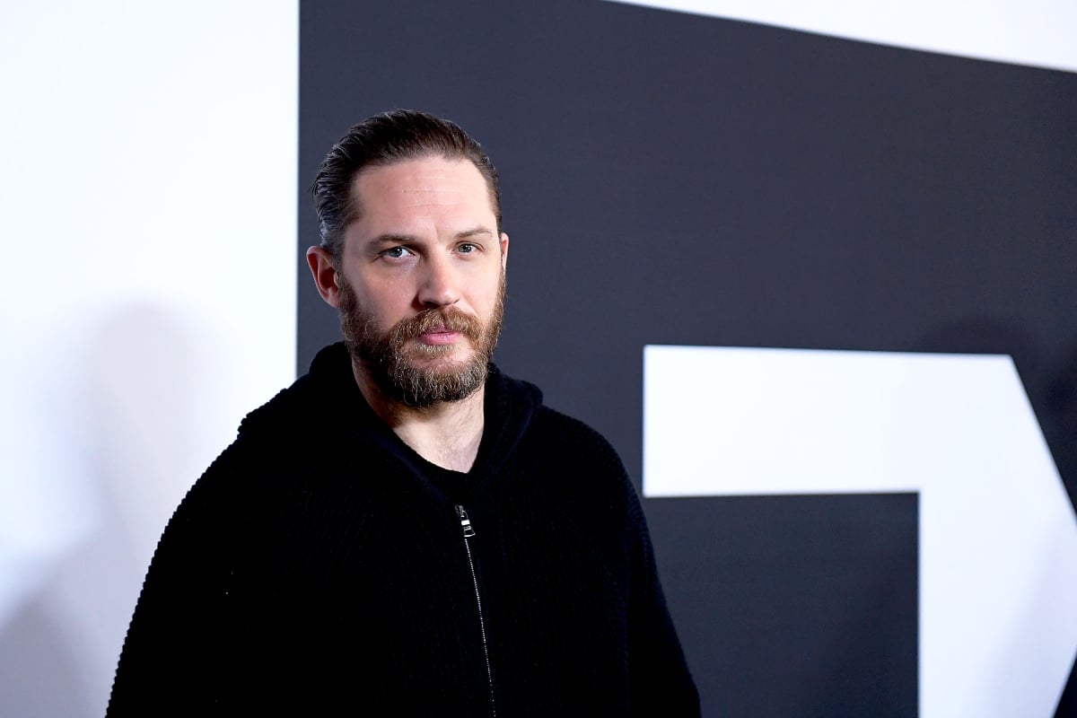 Tom Hardy with slicked back hair and a black zip up hoodie arrives at the Winter TCA Tour FX Starwalk at Langham Hotel on January 12, 2017