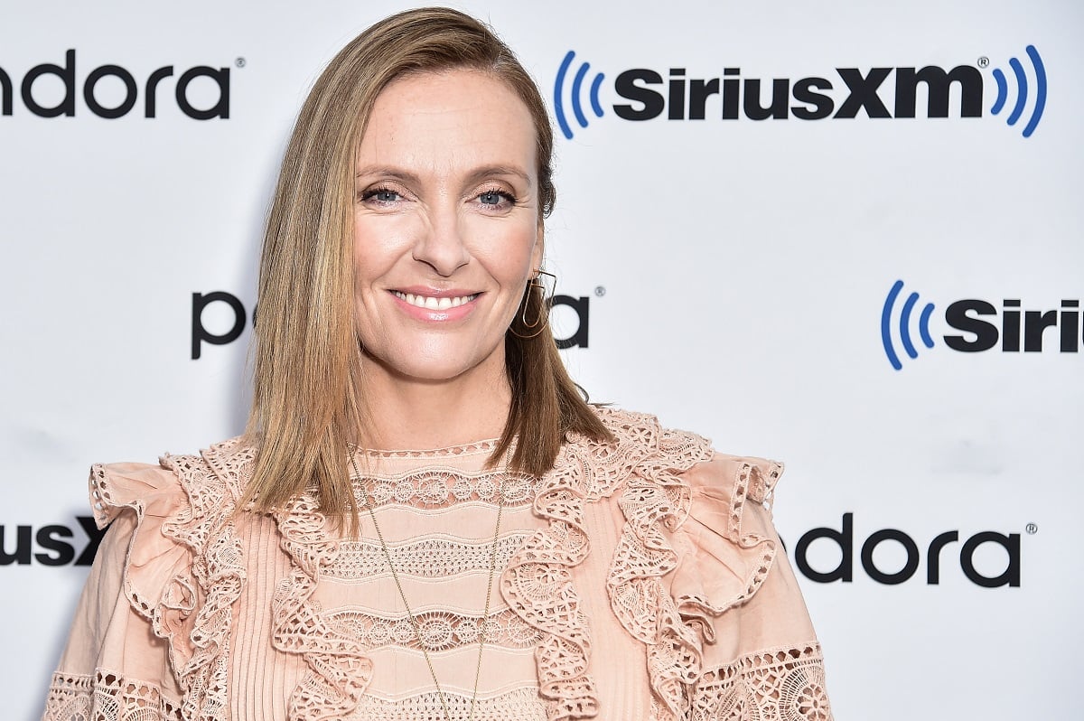 'Pieces of Her' actor Toni Collette wearing a pink dress during a red carpet appearance.