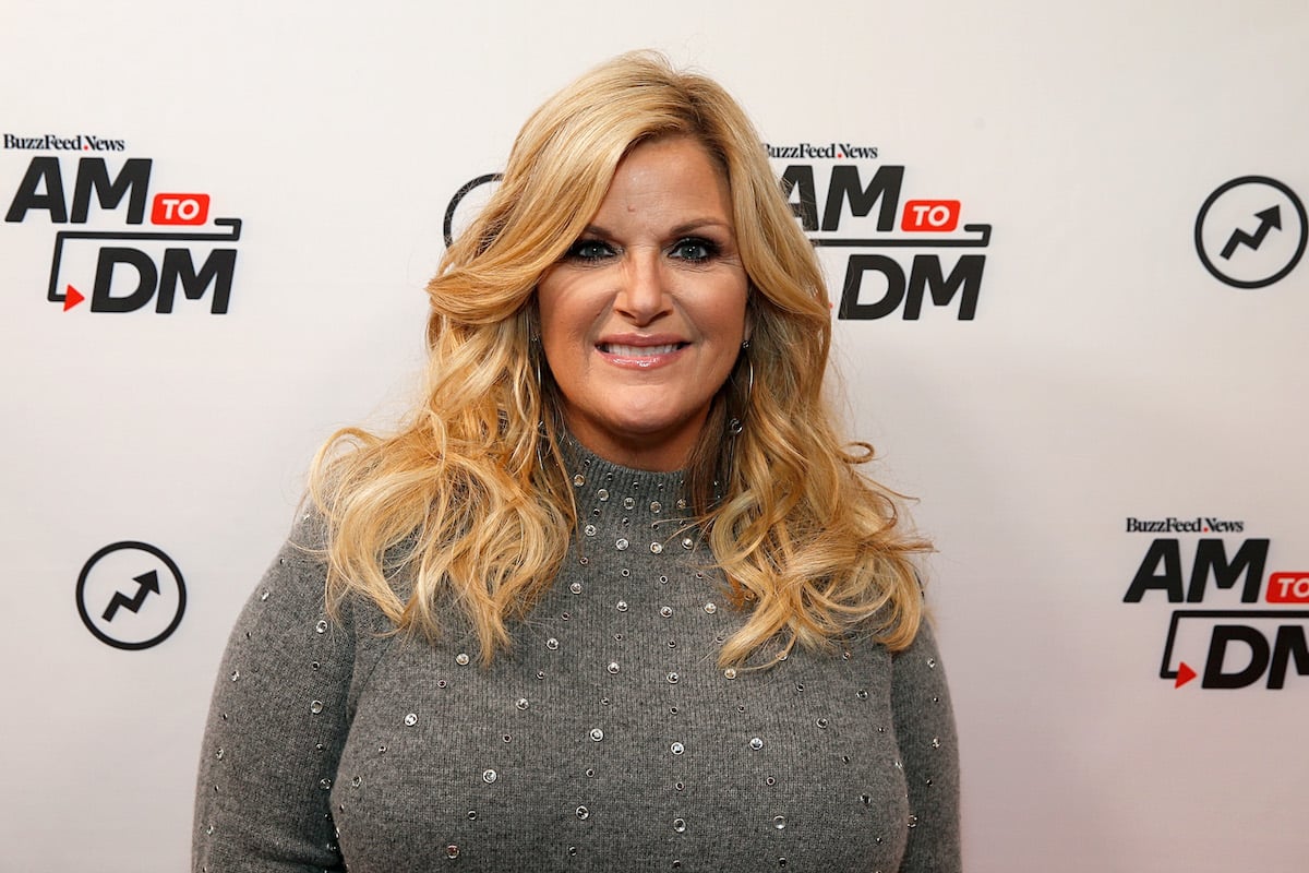 Trisha Yearwood smiling in front of a white background