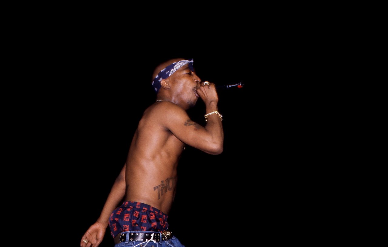 Tupac performs on stage