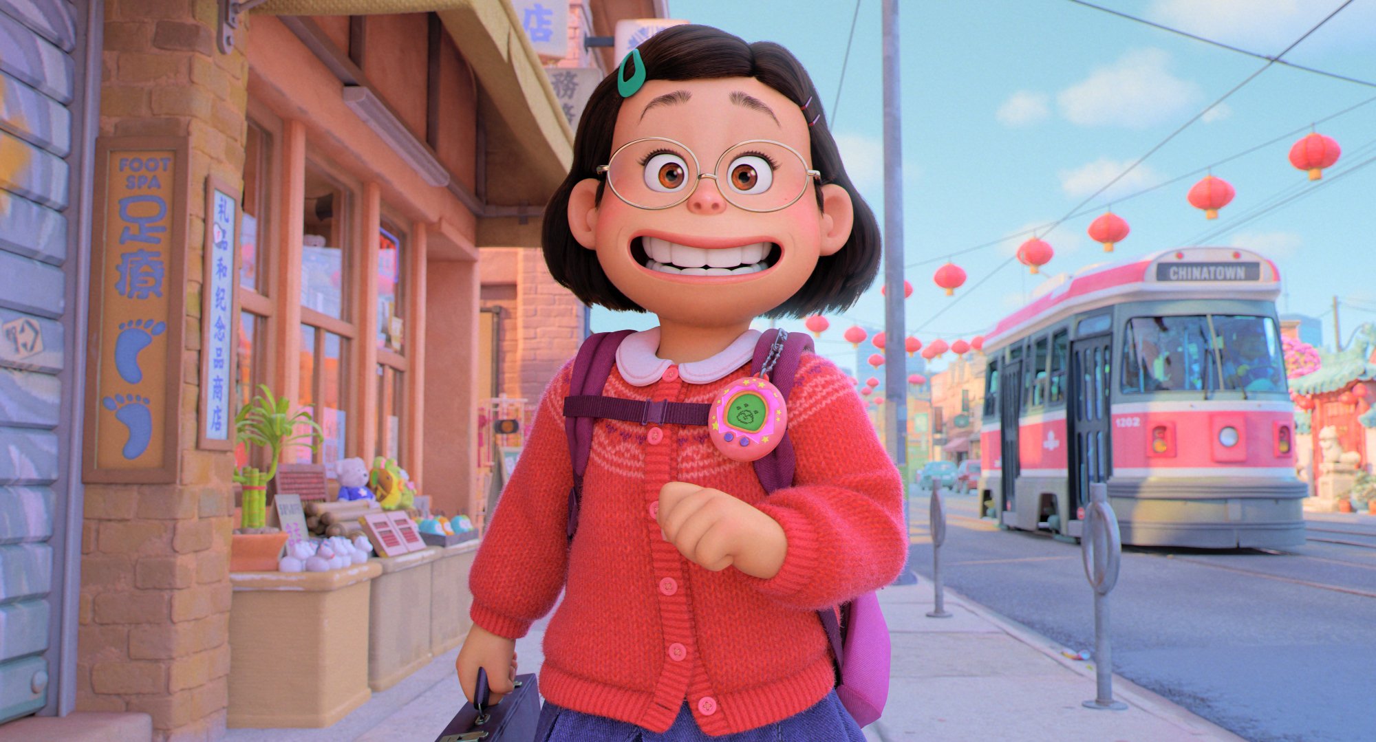 'Turning Red' Mei (Rosalie Chiang) walking down the street happy in a red sweater