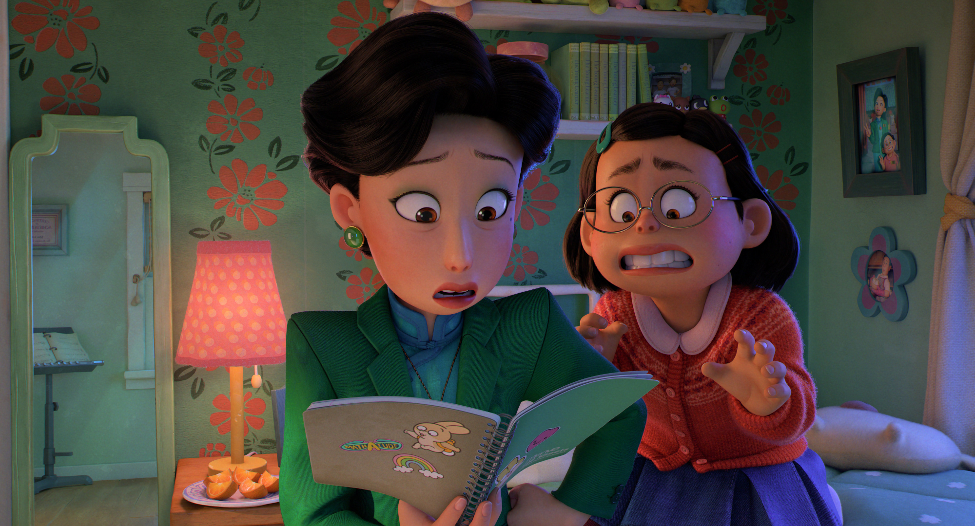 'Turning Red' Ming (Sandra Oh) and Mei (Rosalie Chiang) in movie featuring Billie Eilish and Finneas O'Connell's original songs looking in a scrapbook