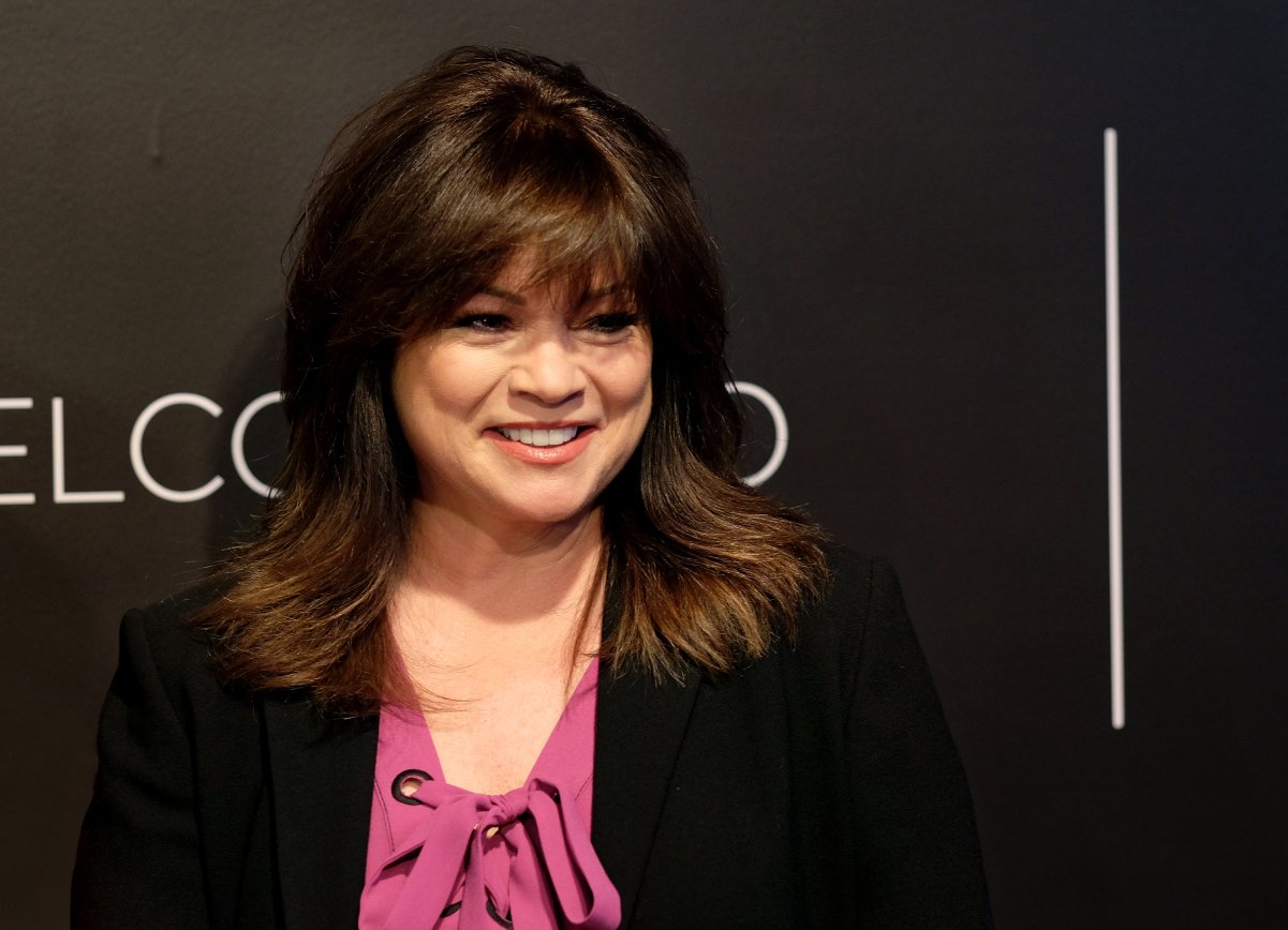 Food Network personality Valerie Bertinelli wears a dark blazer in this photograph.