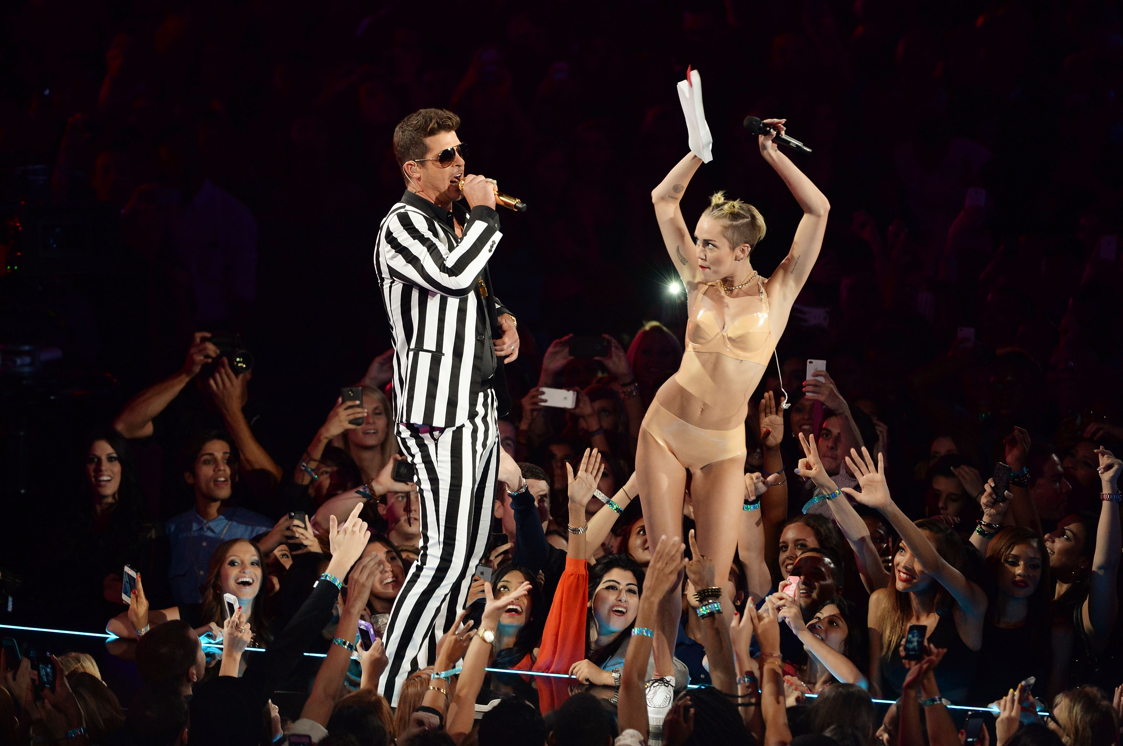Robin Thicke and Miley Cyrus on a stage