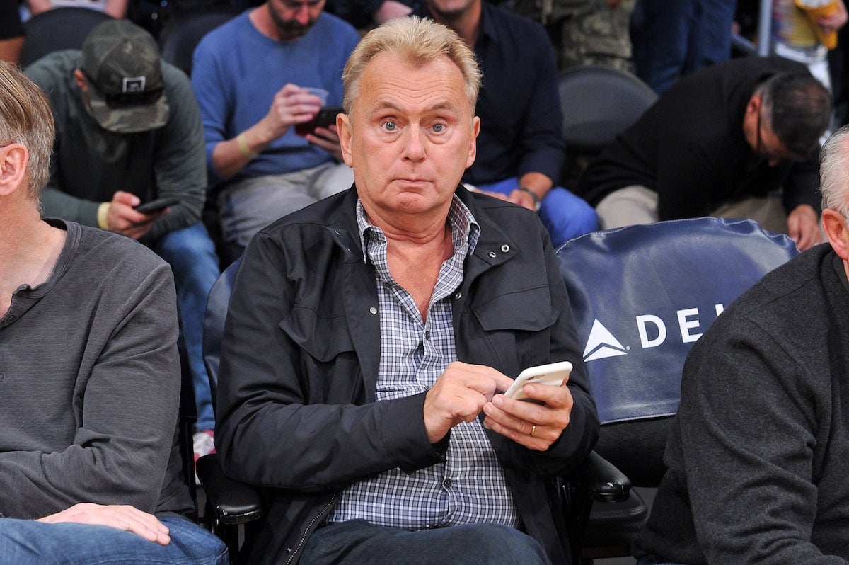 Pat Sajak looks surprised while sitting in the front row of a Lakers basketball game