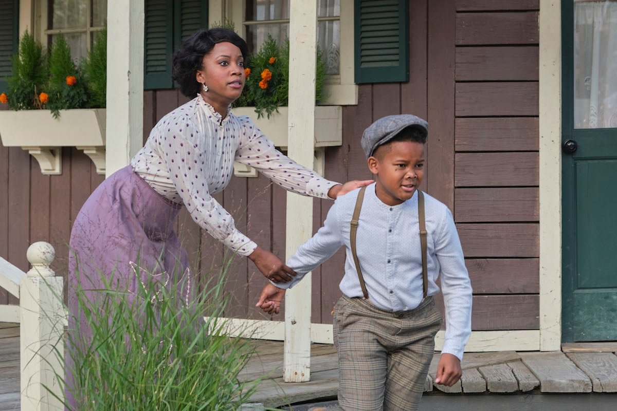 Minnie Canfield grabbing the arm of her son Cooper in 'When Calls the Heart' Season 9 Episode 4 