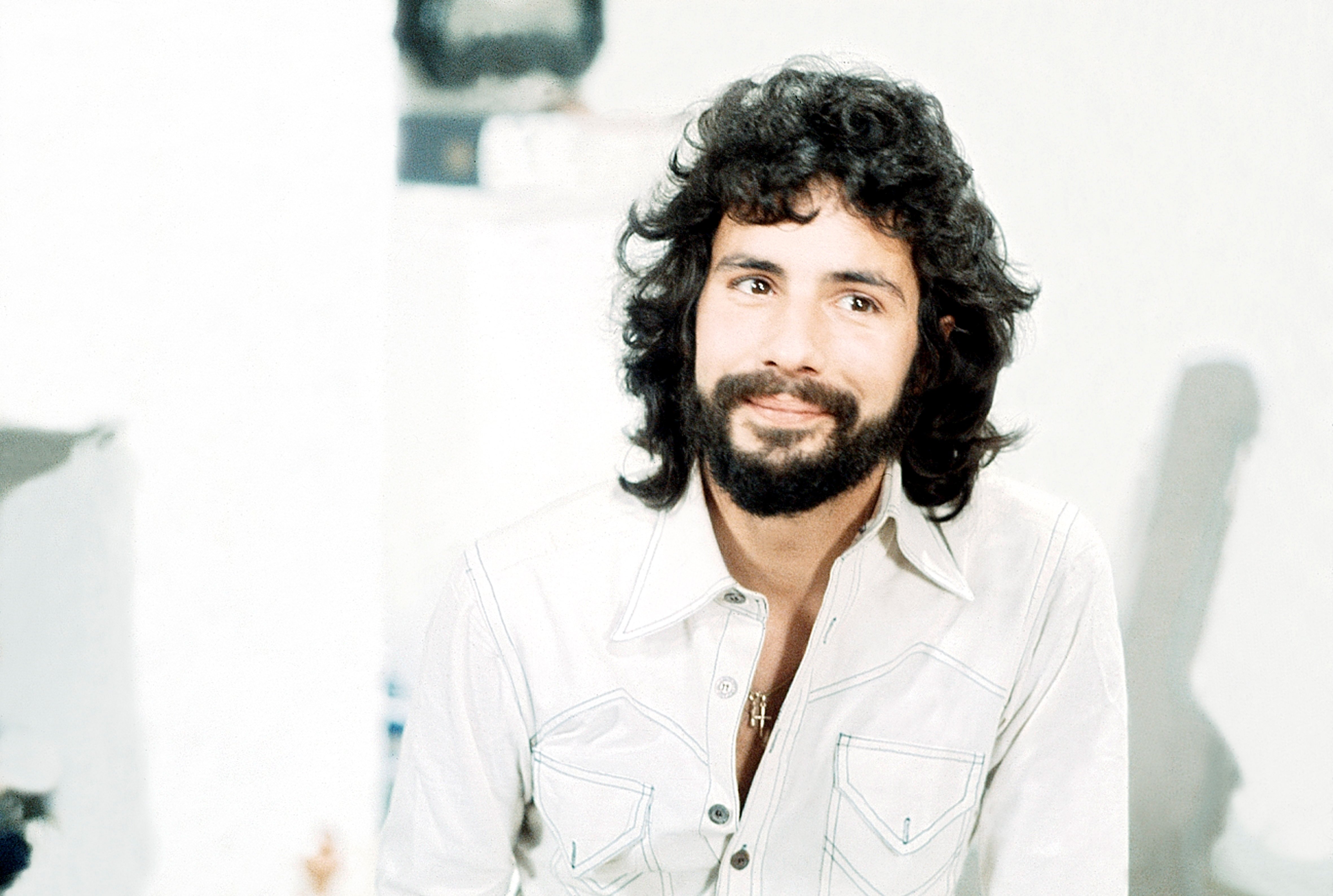 Cat Stevens wearing a white shirt