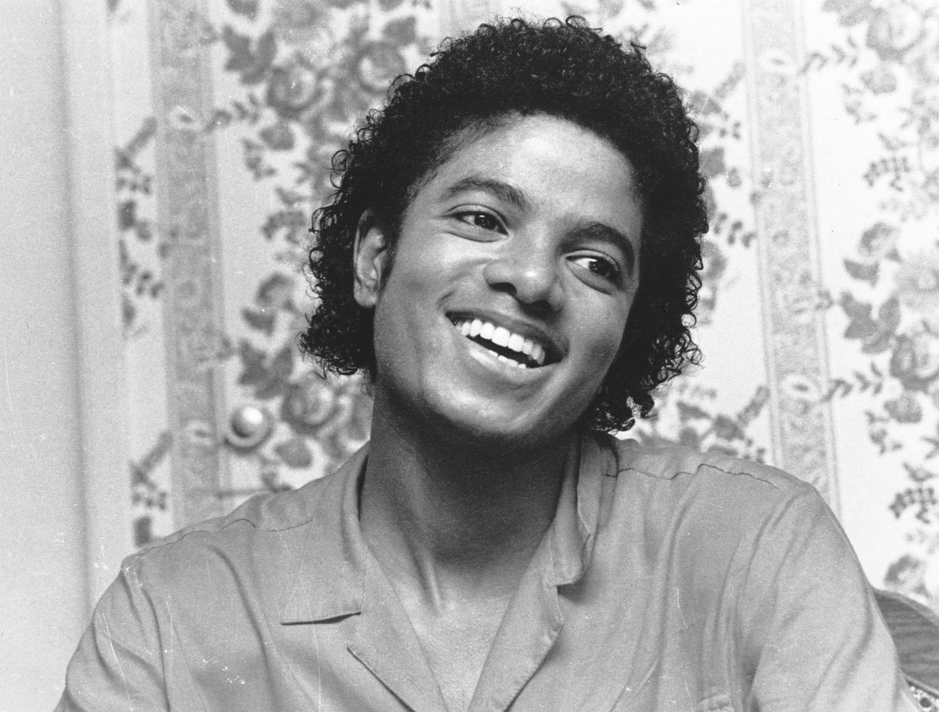 Michael Jackson smiling during the "Beat It" era