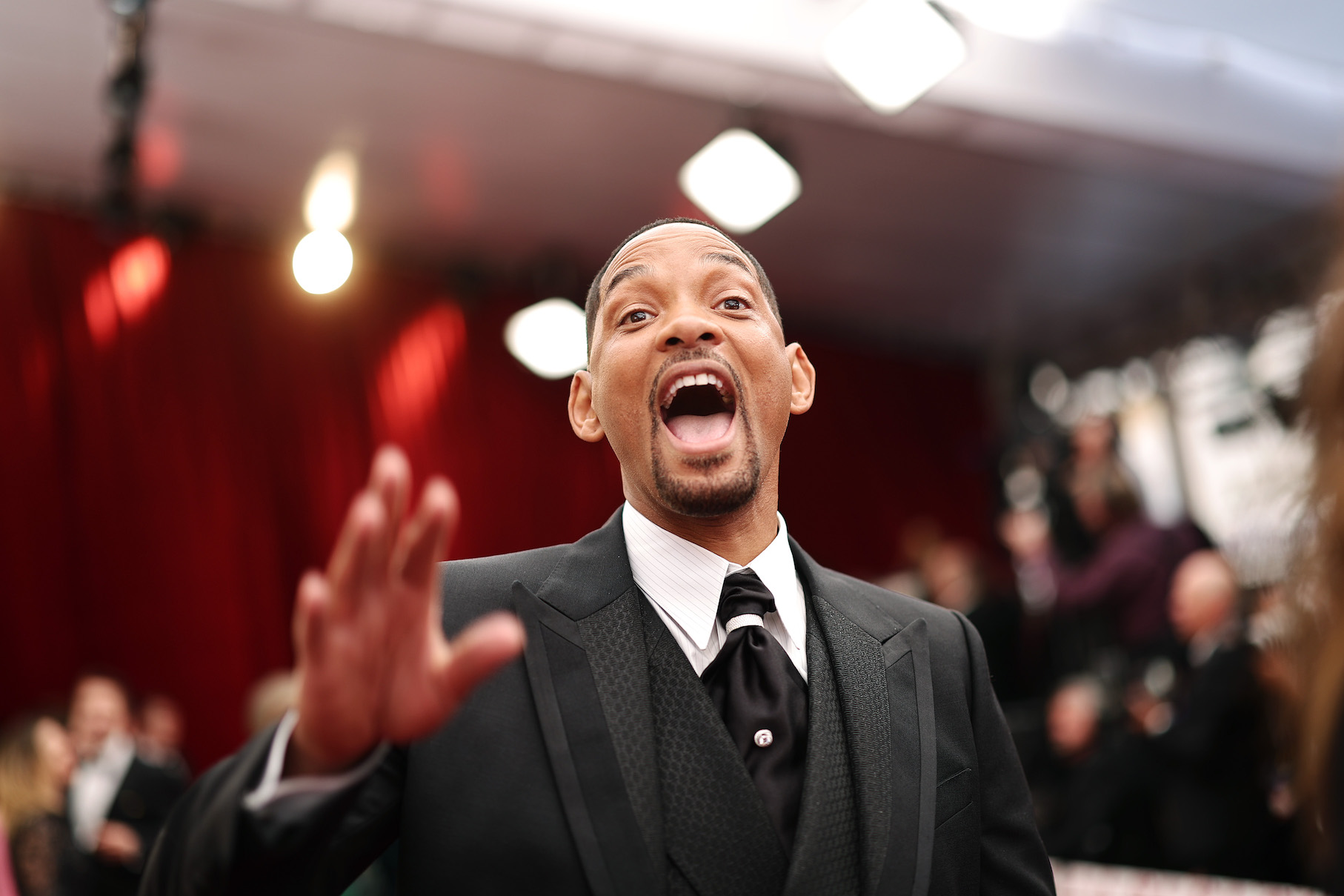 Will Smith at the Oscars 2022 looking excited with his mouth open