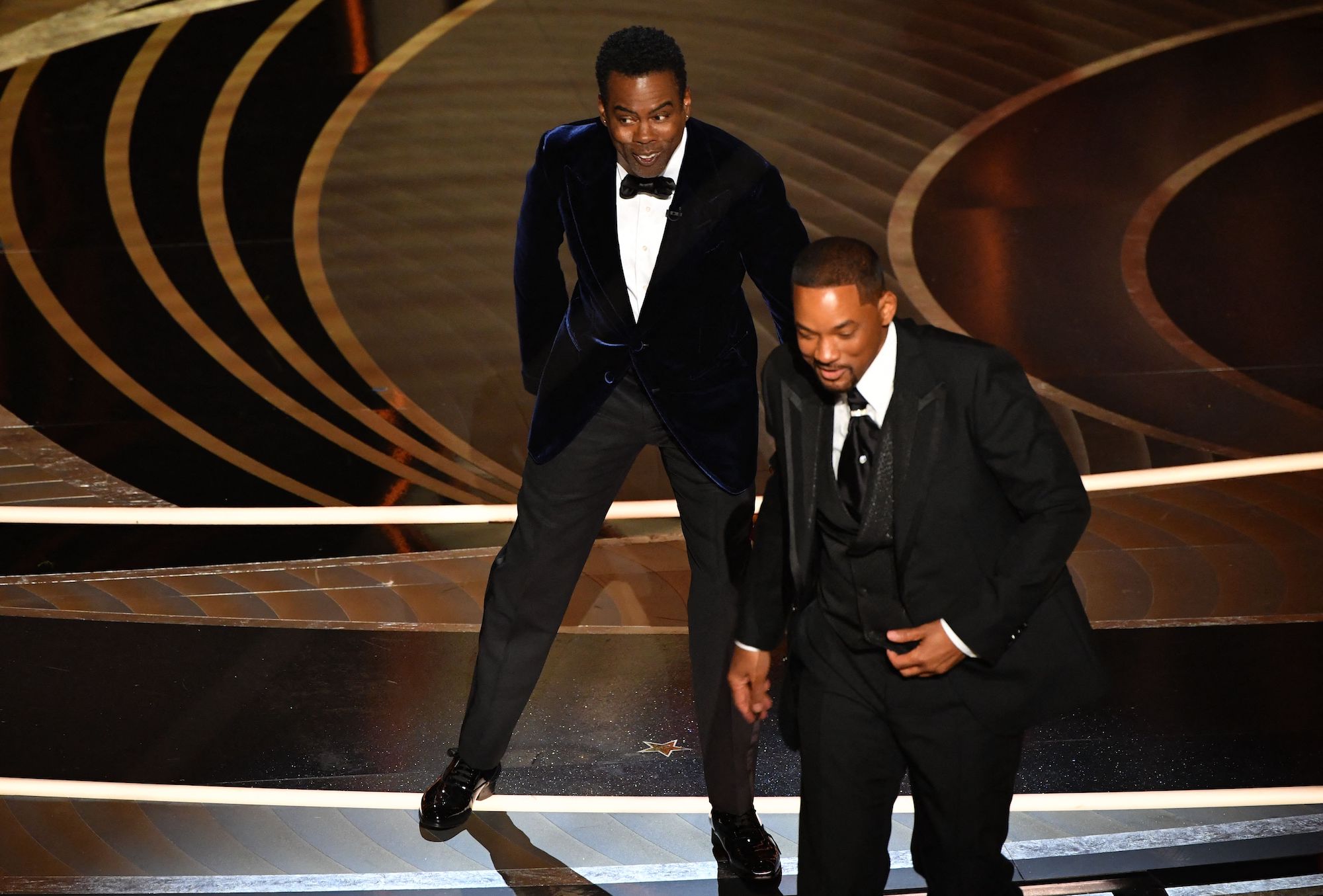 Will Smith walks away after slapping Chris Rock at the Oscars