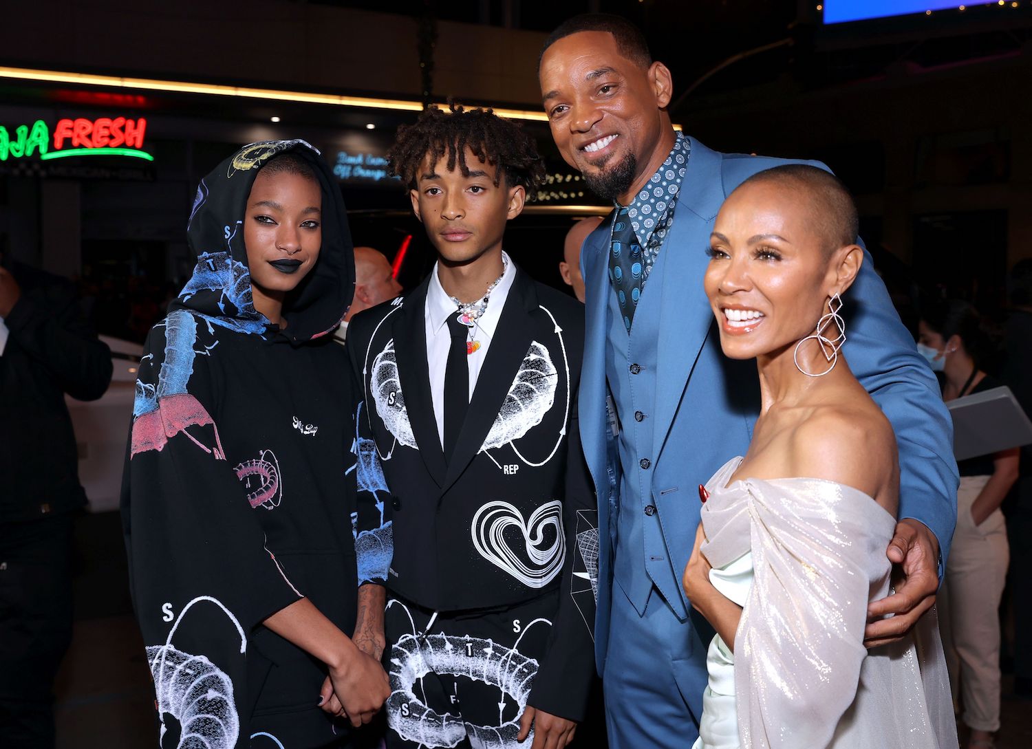 Willow Smith, Jaden Smith, Will Smith, and Jada Pinkett Smith standing together and smiling at an event