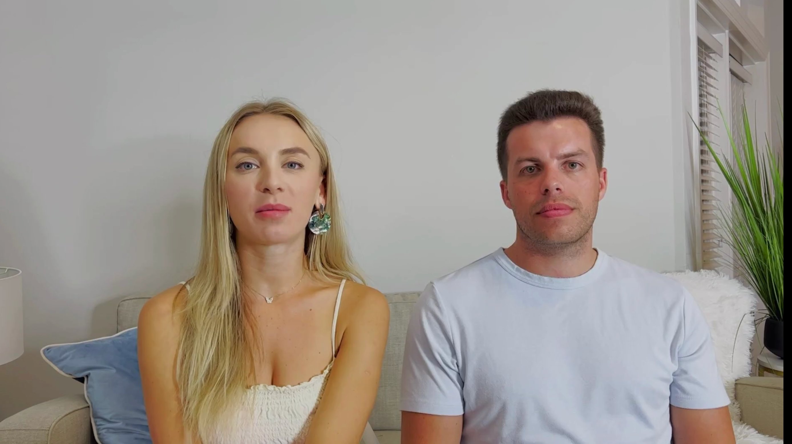 Yara Zaya wearing a white tank top, sitting with her husband Jovi Dufren who is wearing a light blue t-shirt on '90 Day Diaries'.