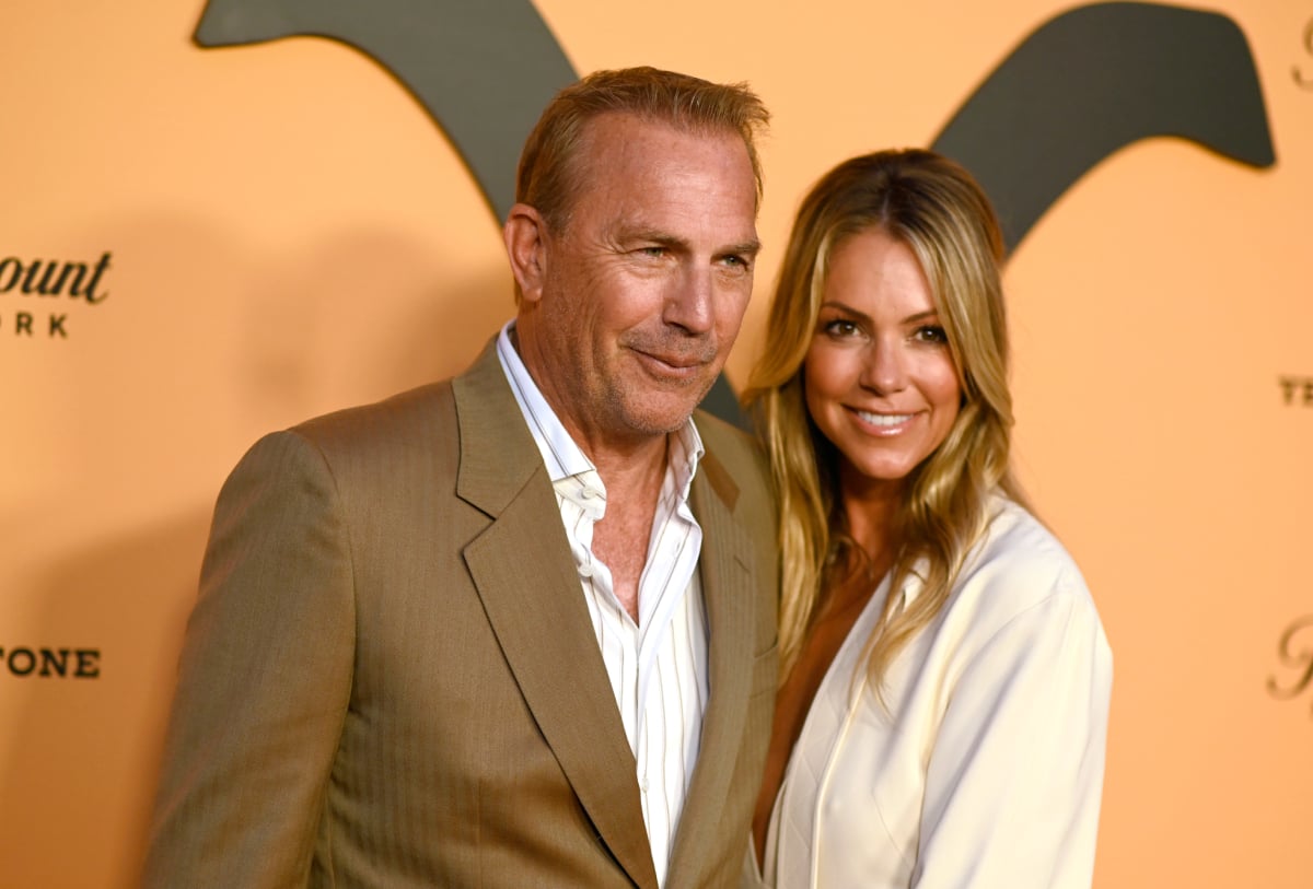 Yellowstone Kevin Costner wearing a tan suit and his beautiful wife Christine Baumgartner attend Paramount Network's Season 2 Premiere Party at Lombardi House on May 30, 2019 in Los Angeles, California