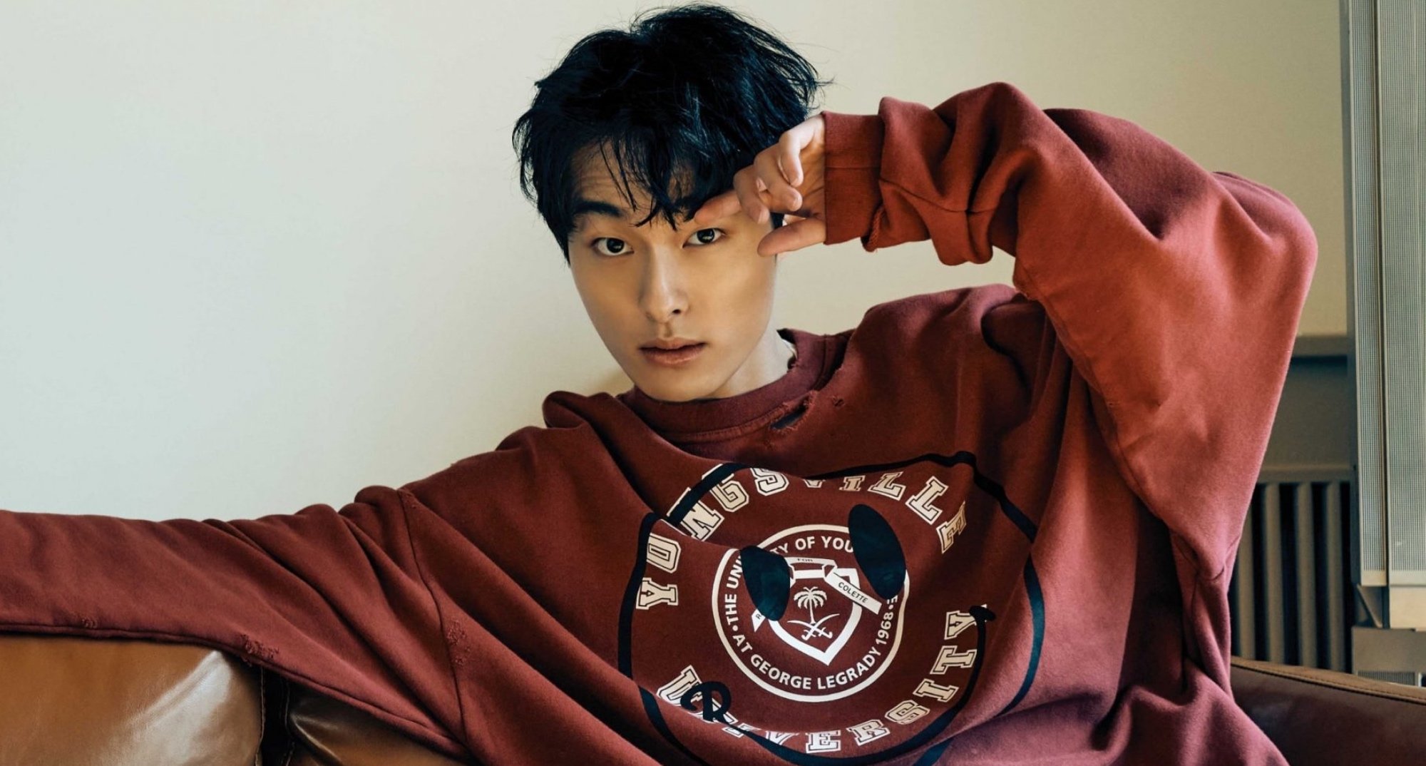 Yoon Chan-young from 'All of Us Are Dead' wearing maroon university pullover.