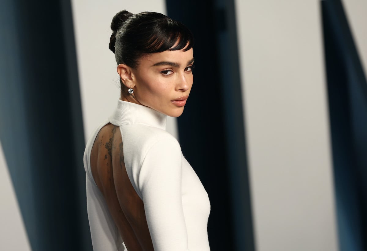 Zoë Kravitz looks over her shoulder in a white gown at the 2022 Vanity Fair Oscar Party