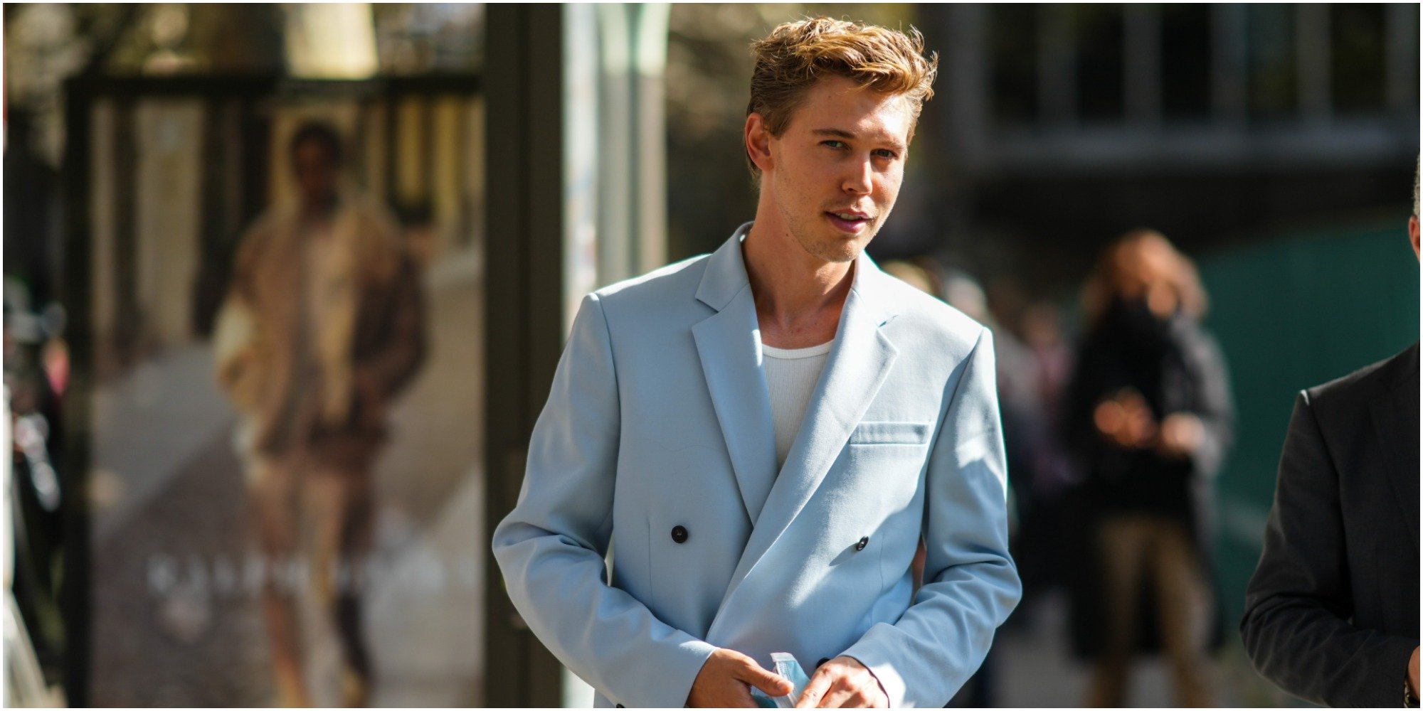 Austin Butler wears a blue suit at a photocall.