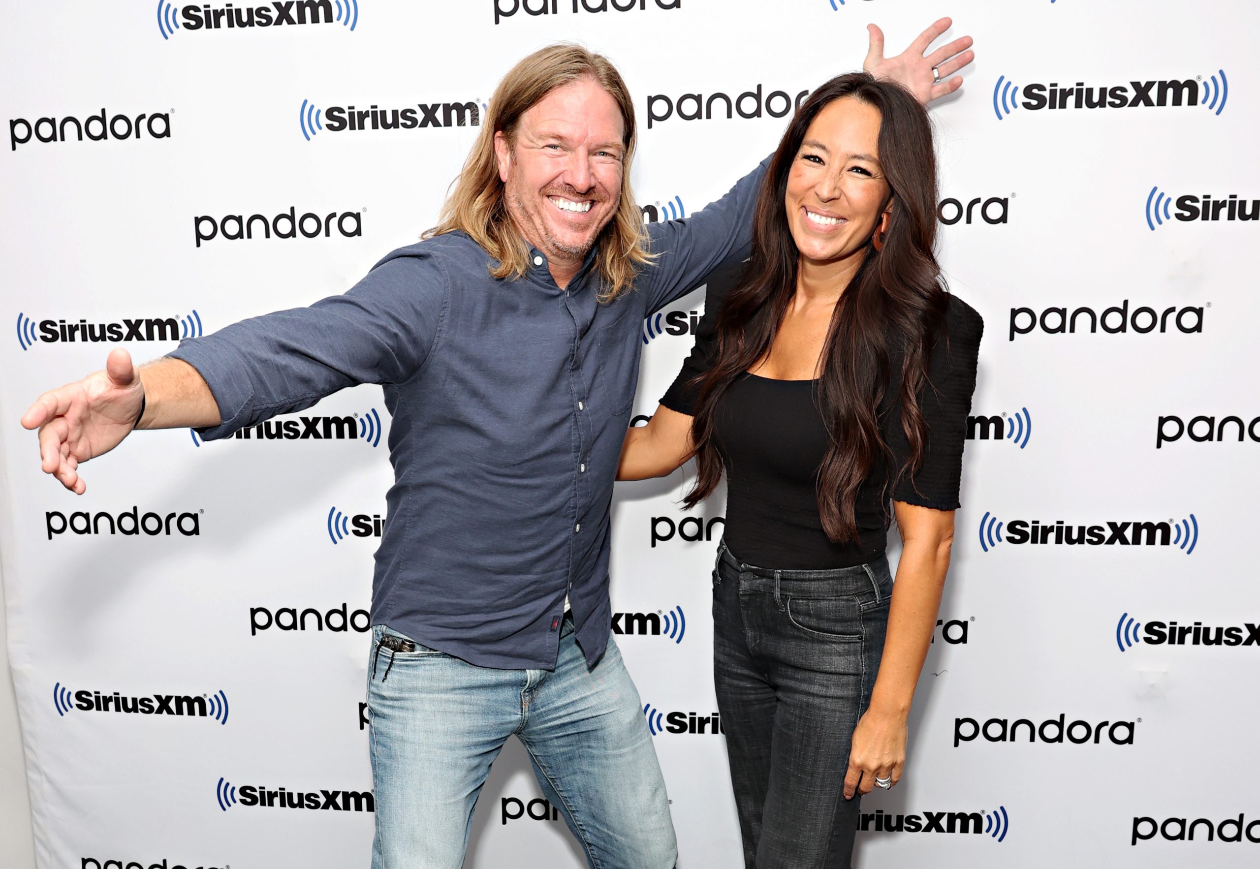 Chip Gaines and Joanna Gaines posing together on their visit ti the SiriusXM studios