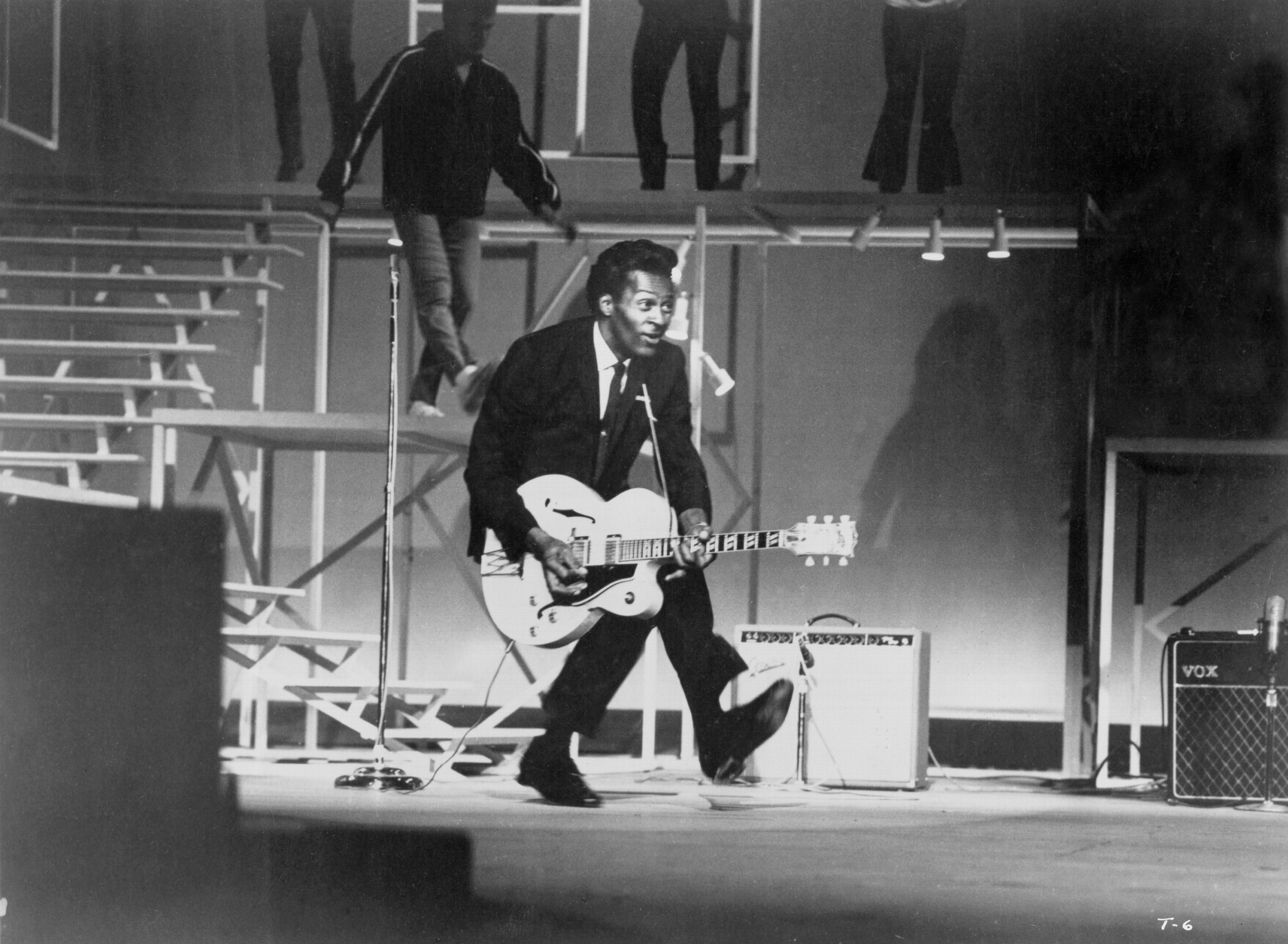 Chuck Berry playing songs on his guitar