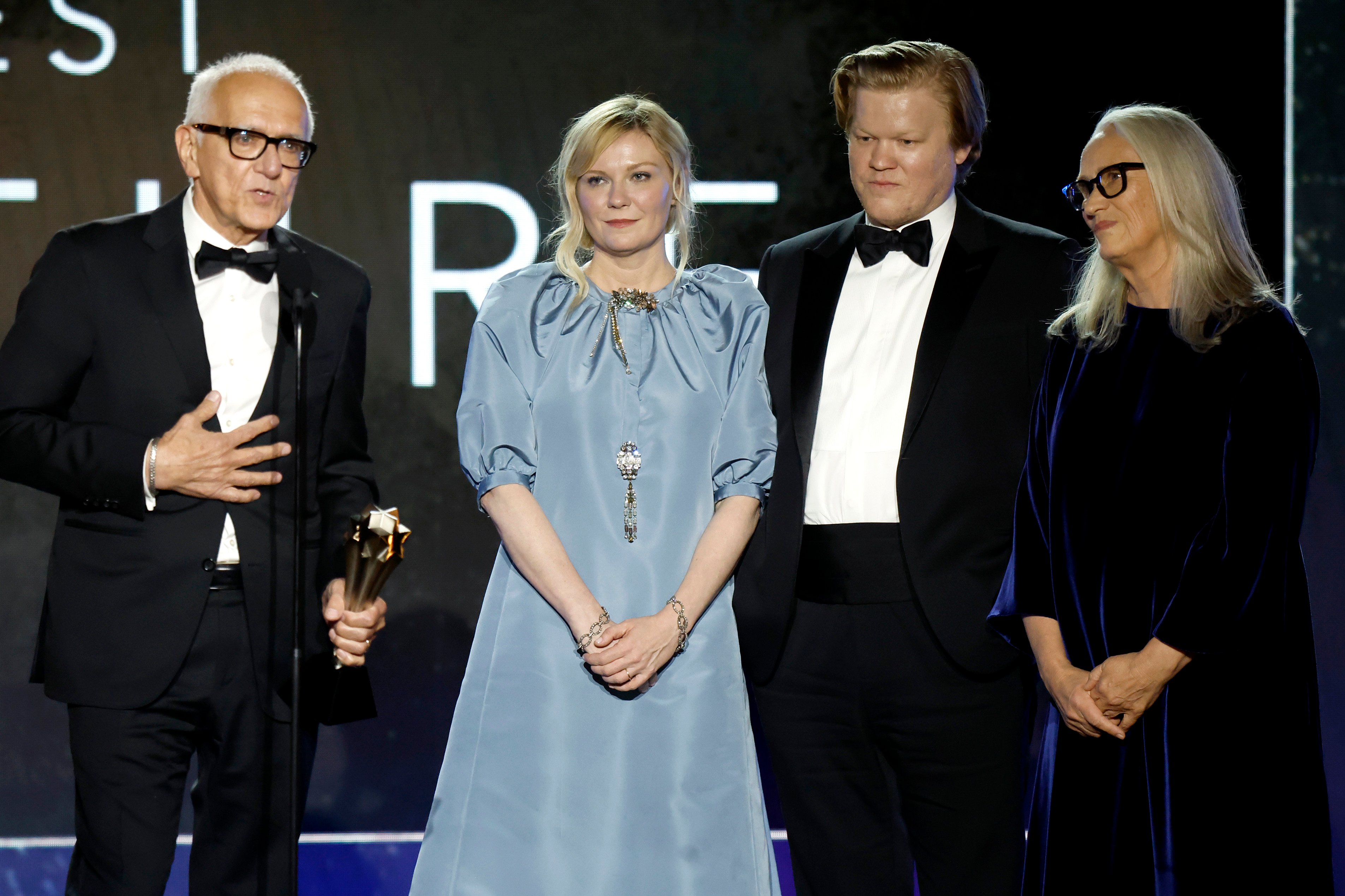 The cast and crew of the netflix film The Power of the Dog accept the Critics Choice Award for Best Picture