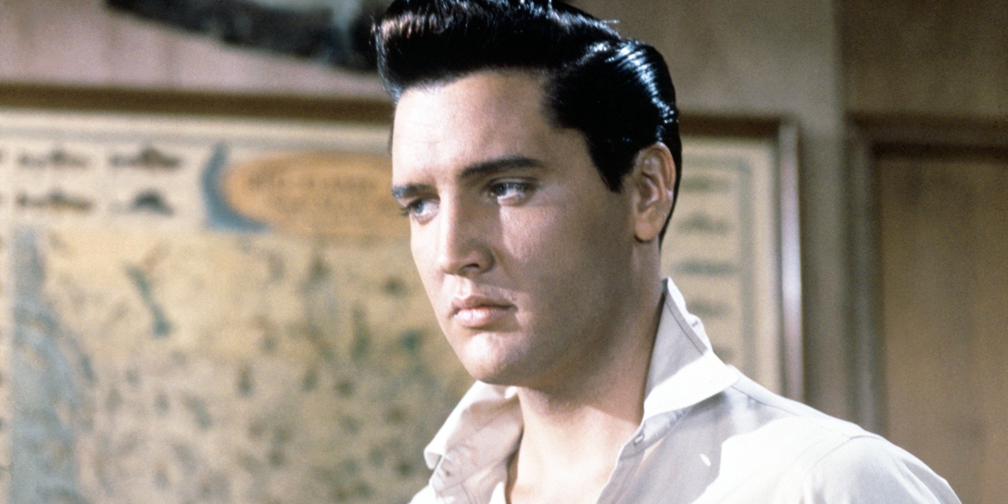 Elvis Presley poses in a scene still from the film Girls, Girls, Girls.