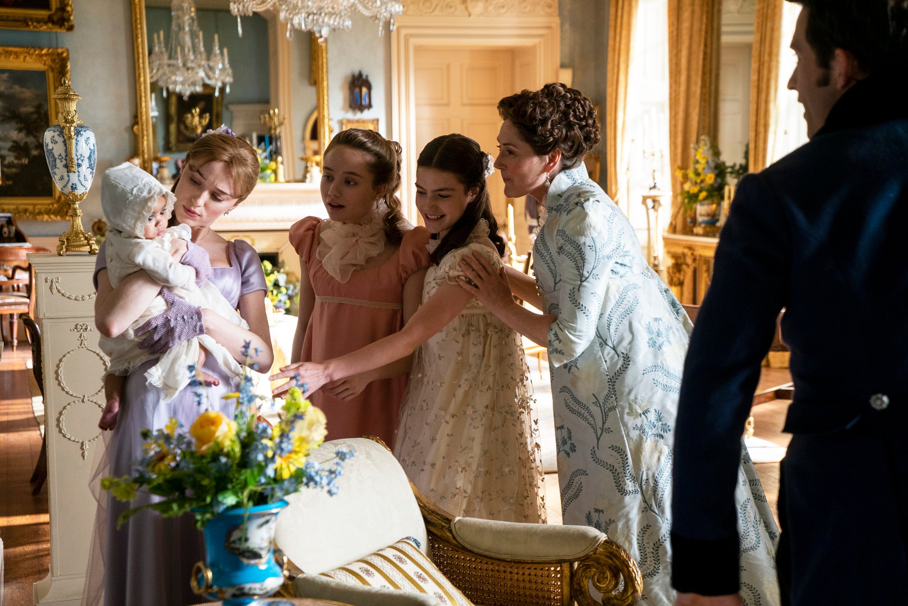 'Bridgerton': Arianna and Ava Gittens-Roberts as Baby Augie, Phoebe Dyvenor as Daphne Basset, Ruby Stokes as Francesca Bridgerton, Florence Emilia Hunt as Hyacinth Bridgerton, Ruth Gemmell as Lady Violet Bridgerton, Jonathan Bailey as Anthony Bridgerton as they all look at the new baby