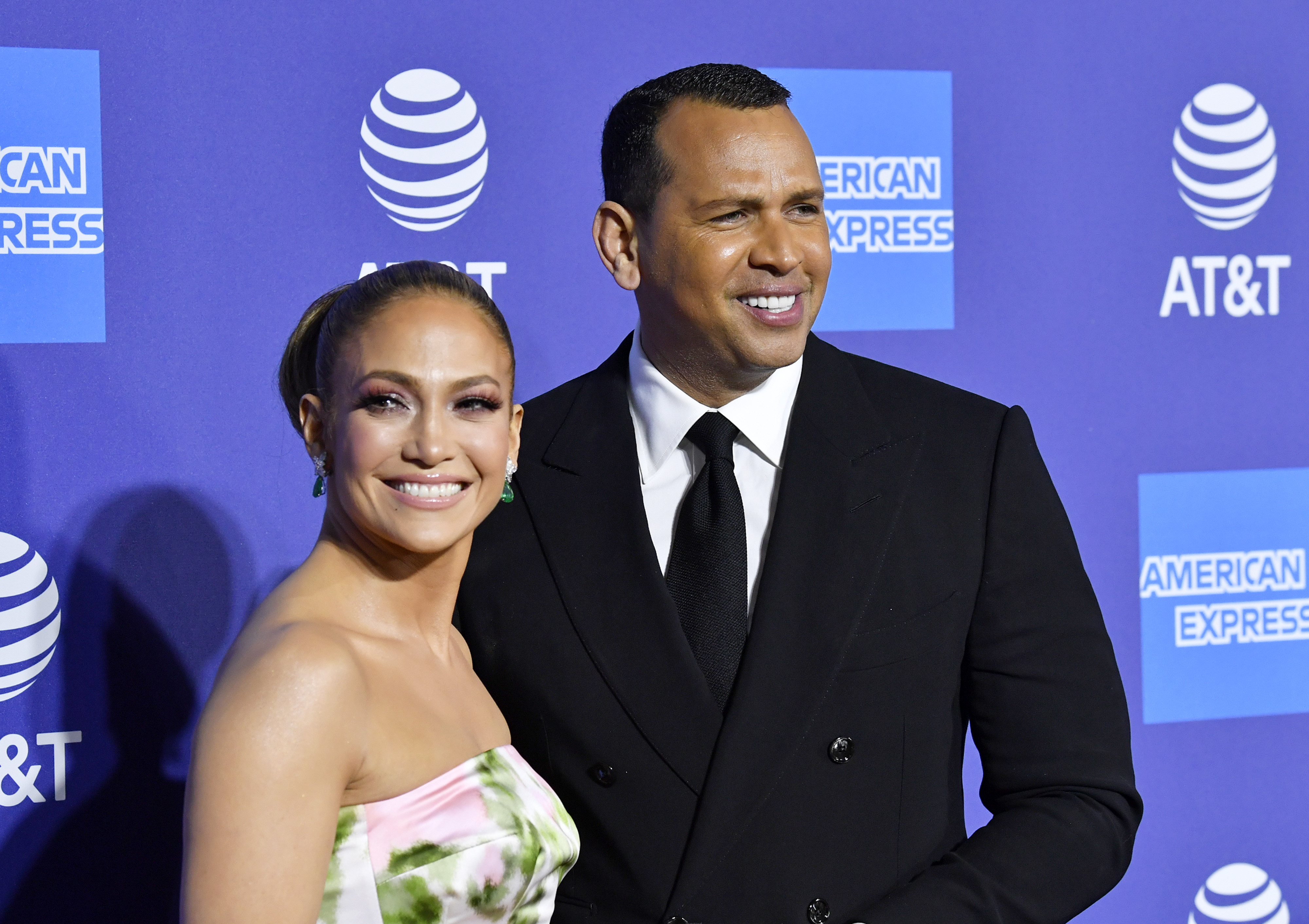 Jennifer Lopez and Alex Rodriguez pose at an event. 