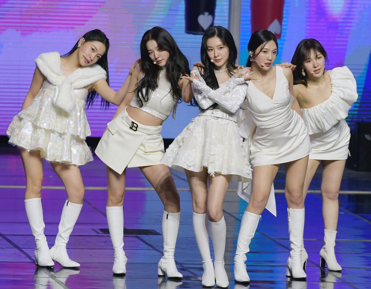 Red Velvet stand on stage in all-white.