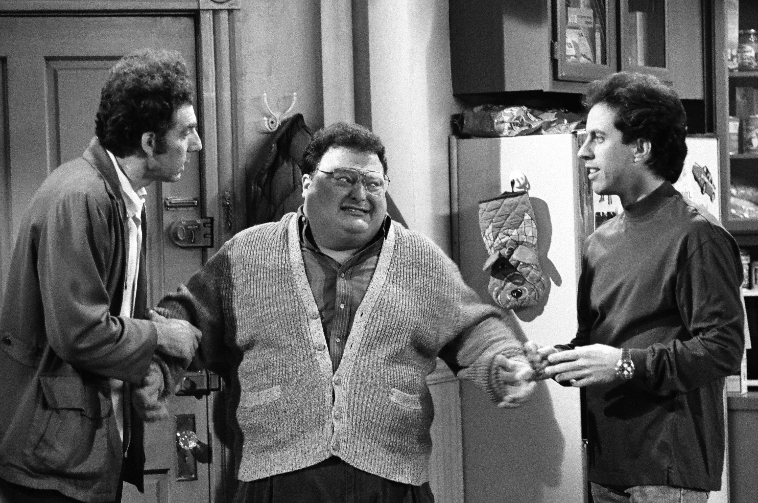 Cosmo Kramer, Newman and Jerry Seinfeld in Jerry's apartment during an episode of 'Seinfeld'