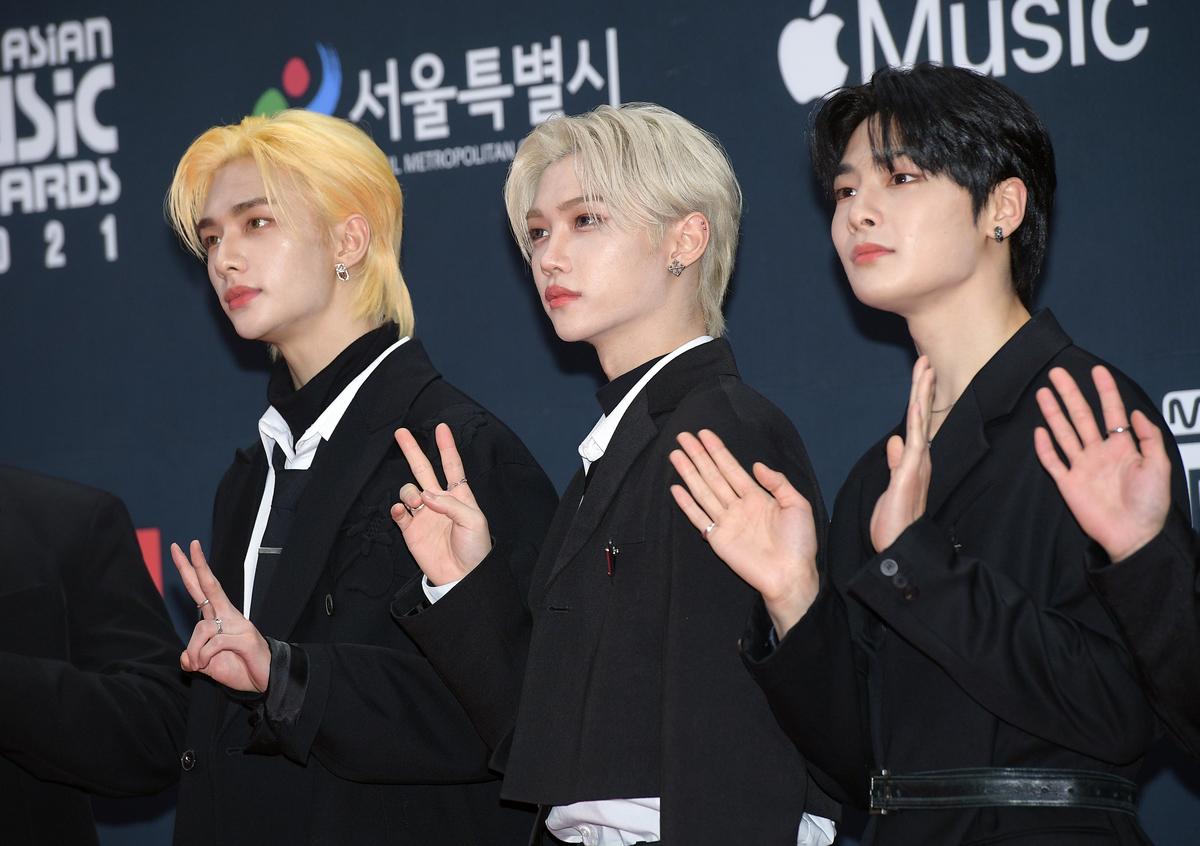 Hyunjin,Felix and I.N in black suits on the red carpet of the MAMA Awards in Seoul, Korea.