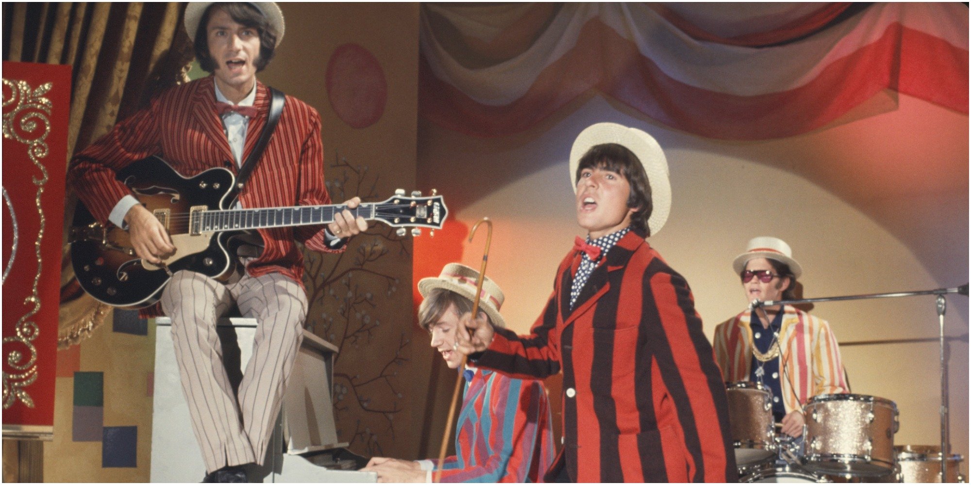 The Monkees cast includes Davy Jones, Mike Nesmith, Mickey Dolenz, and Peter Tork.