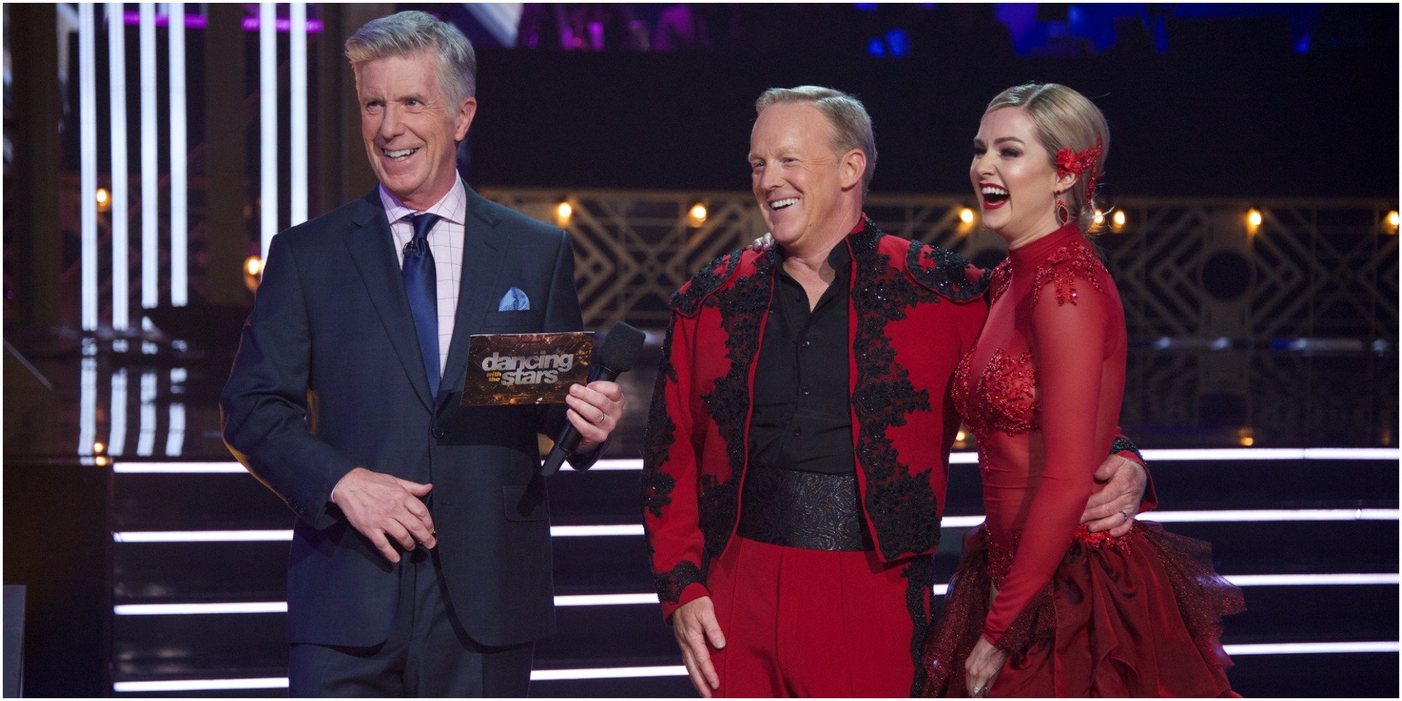 Tom Bergeron, Sean Spicer and Lindsay Arnold on the set of Dancing with the Stars. 