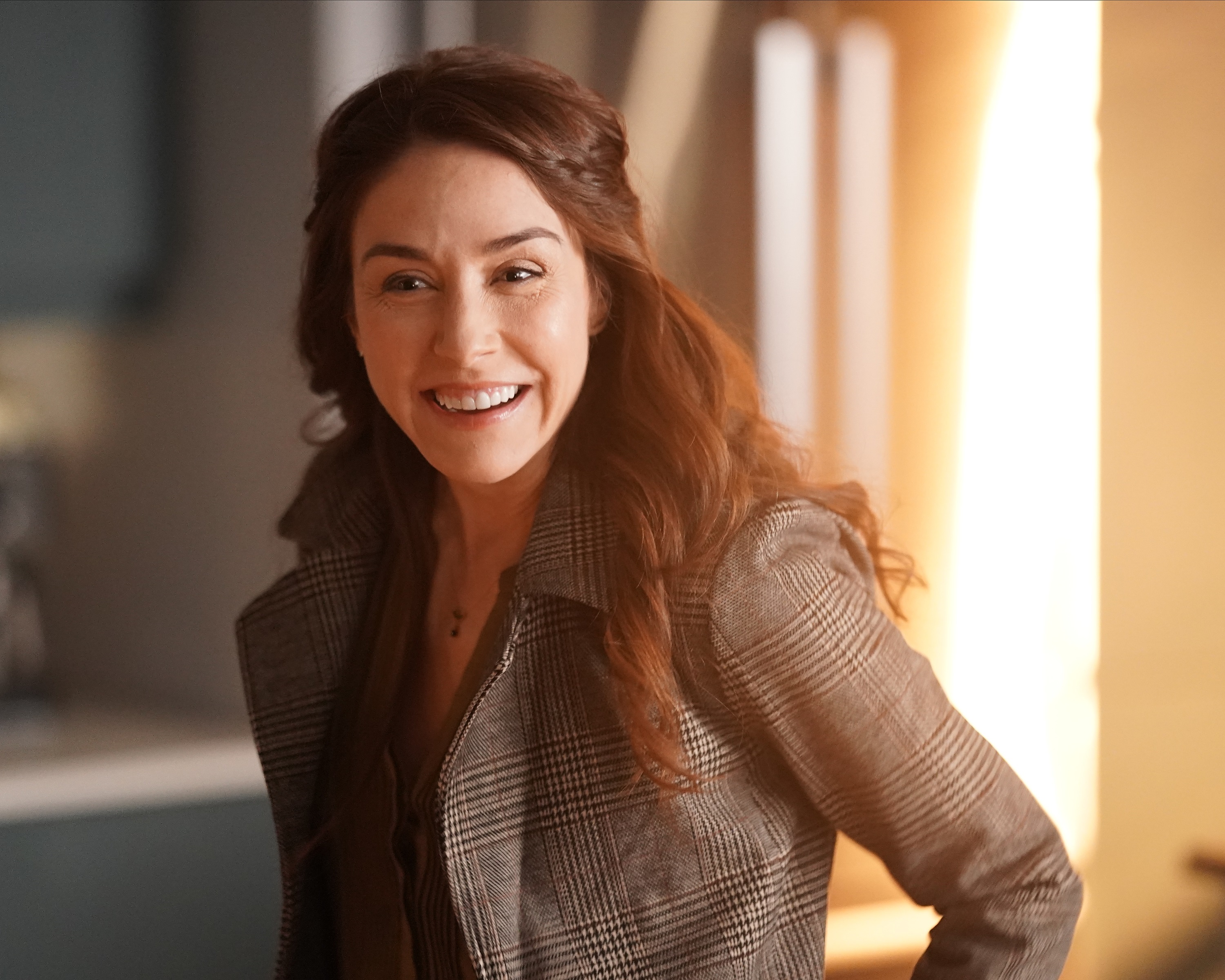 Erin Karpluk returns in the 'A Million Little Things' season 4 cast as Anna Benoit smiling